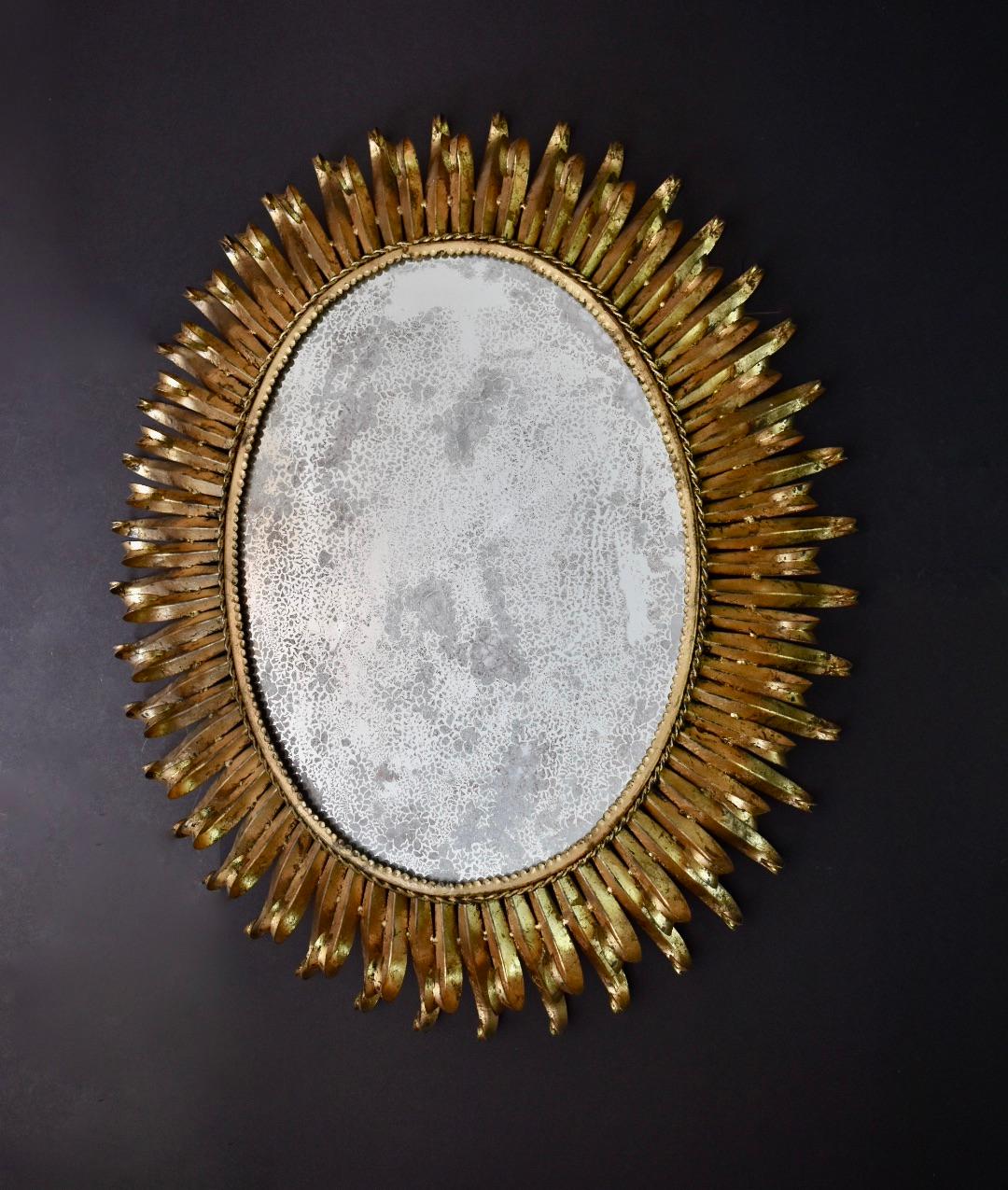 Large Oval Gilt Iron Sunburst Soleil Wall Mirror In Good Condition For Sale In Dallas, TX
