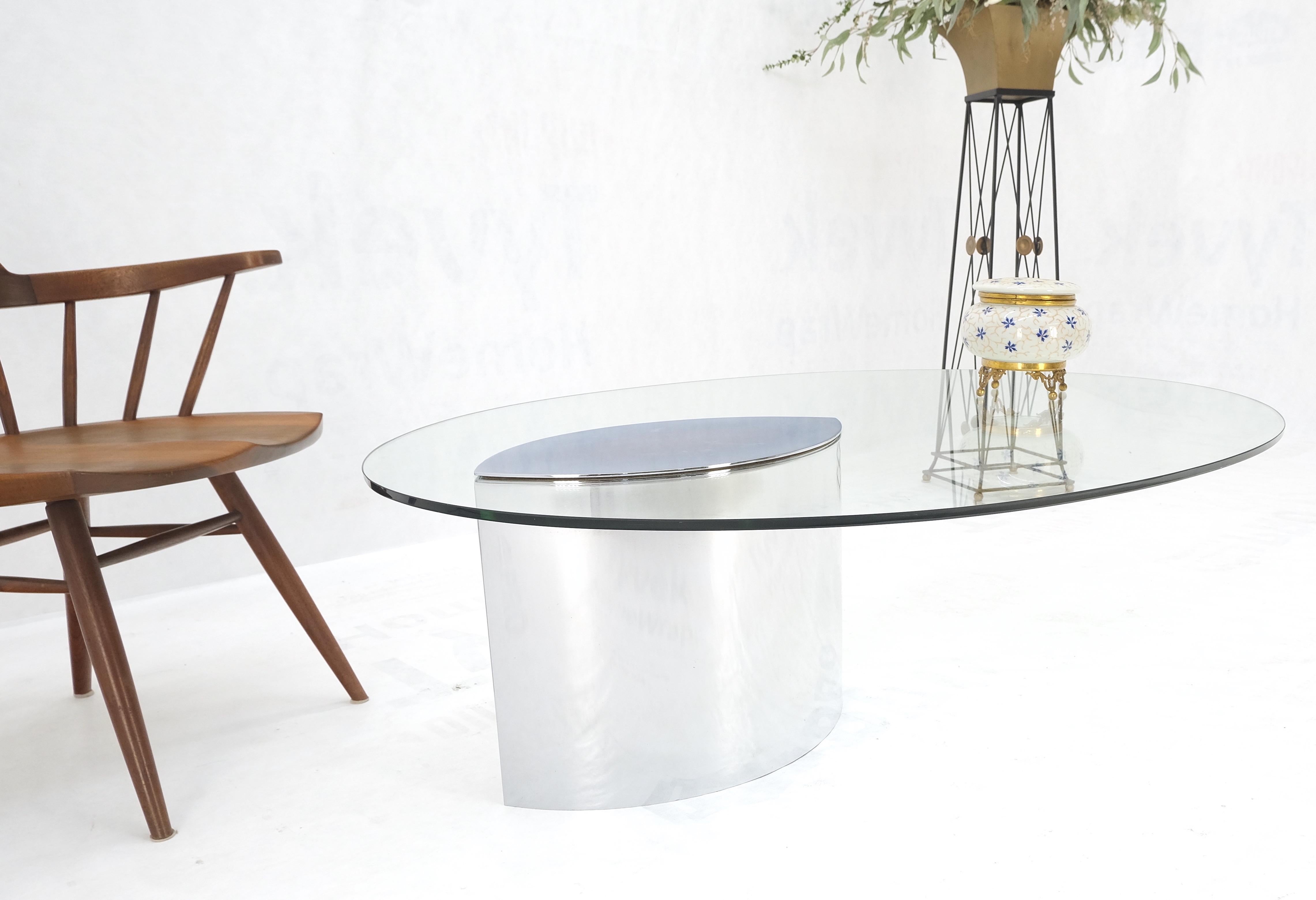 oval glass and chrome coffee table