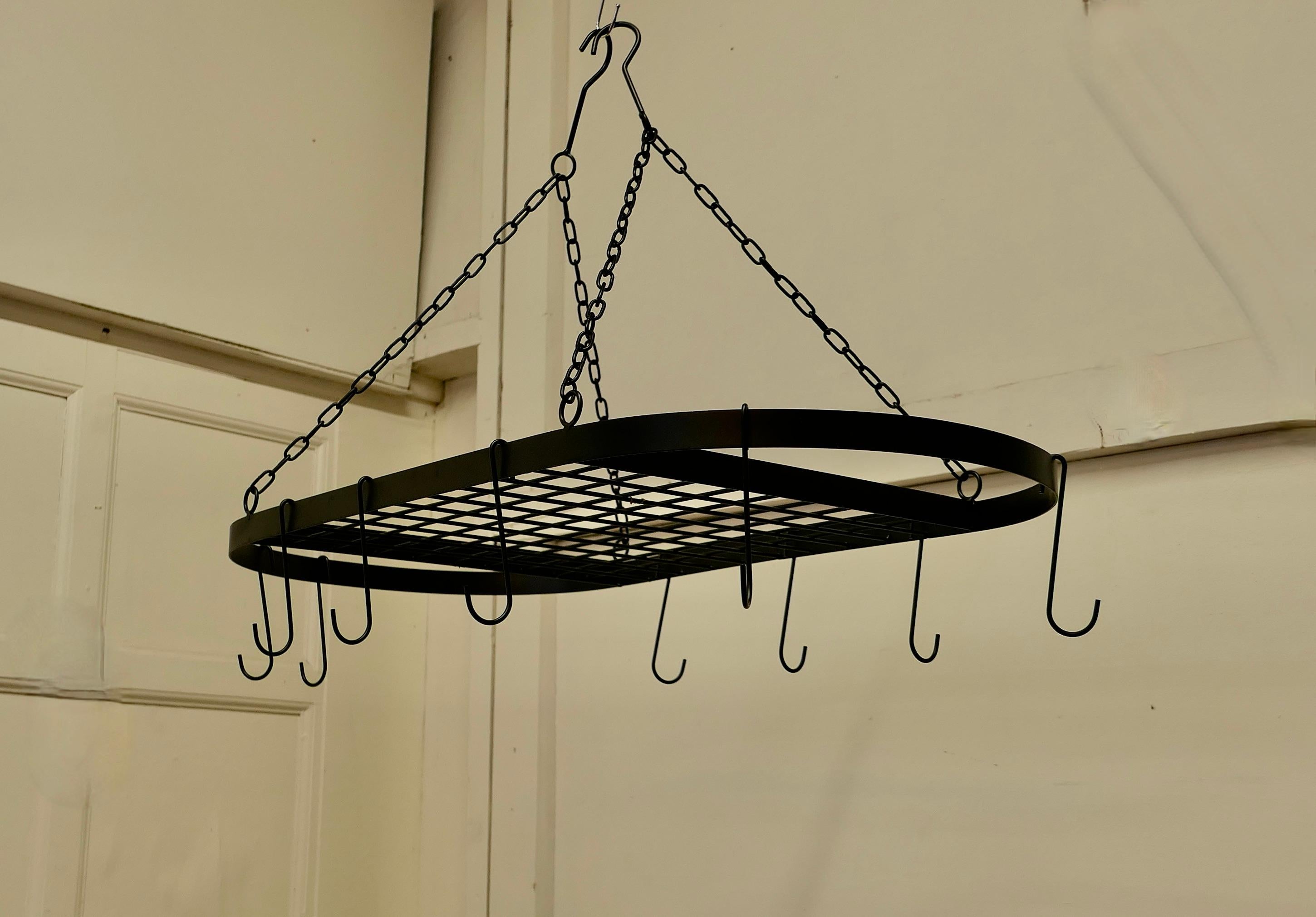 Large Oval Iron Game Hanger, Kitchen Utensil or Pot Hanger

A great piece with lots of Character, it hangs on 2 separate hooked chains, these can be suspended together or wide apart, this is an oval piece with 10 removable iron hooks and an oval