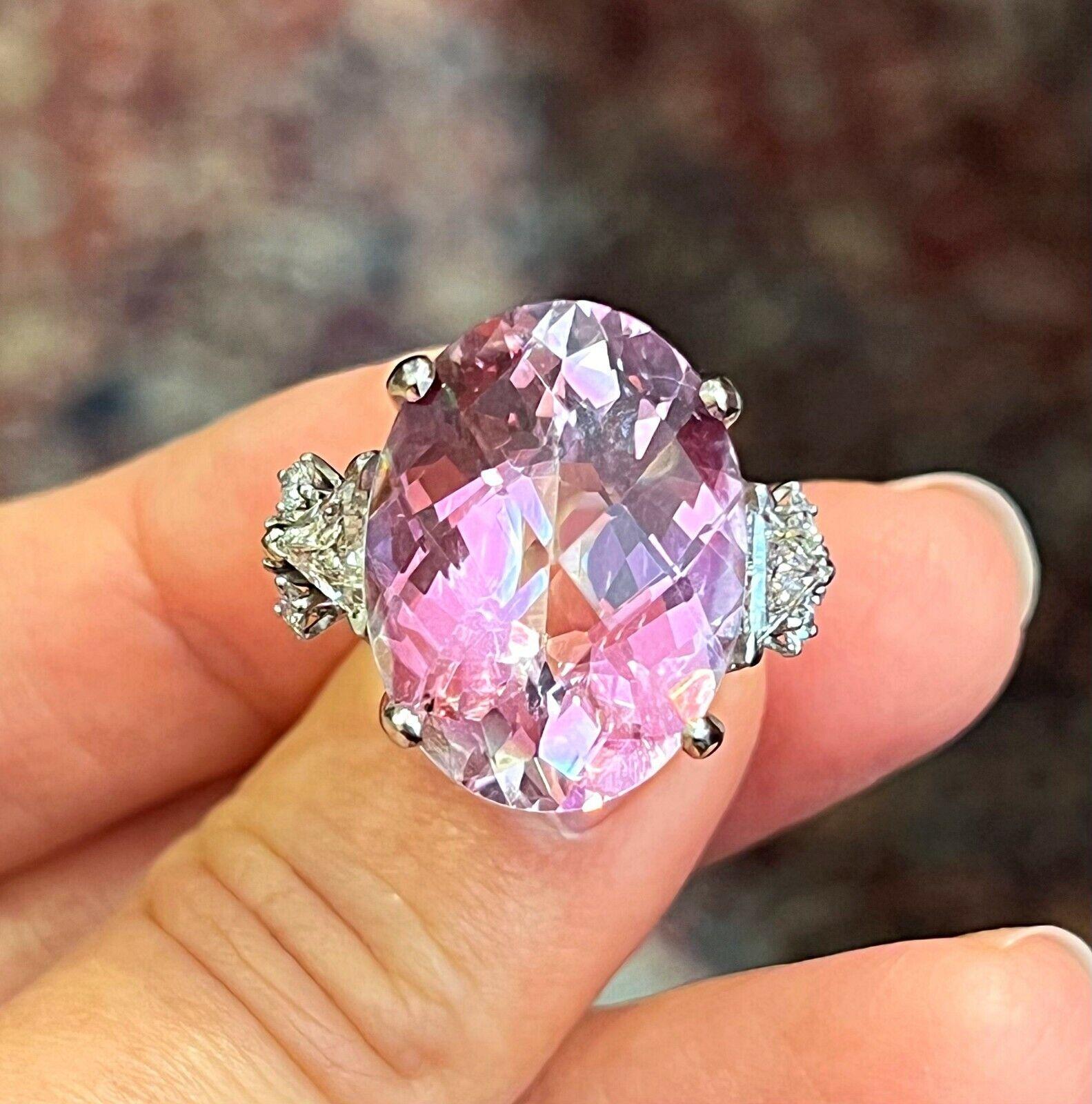 Large Oval Kunzite and Diamond Ring in Platinum

Large Oval Kunzite and Diamond Ring features a 22.50 carat Oval-shaped Kunzite in the center accented by 2 Trillion-cut Diamond and 6 Round Brilliant-cut Diamond set in Platinum.

Total kunzite weight