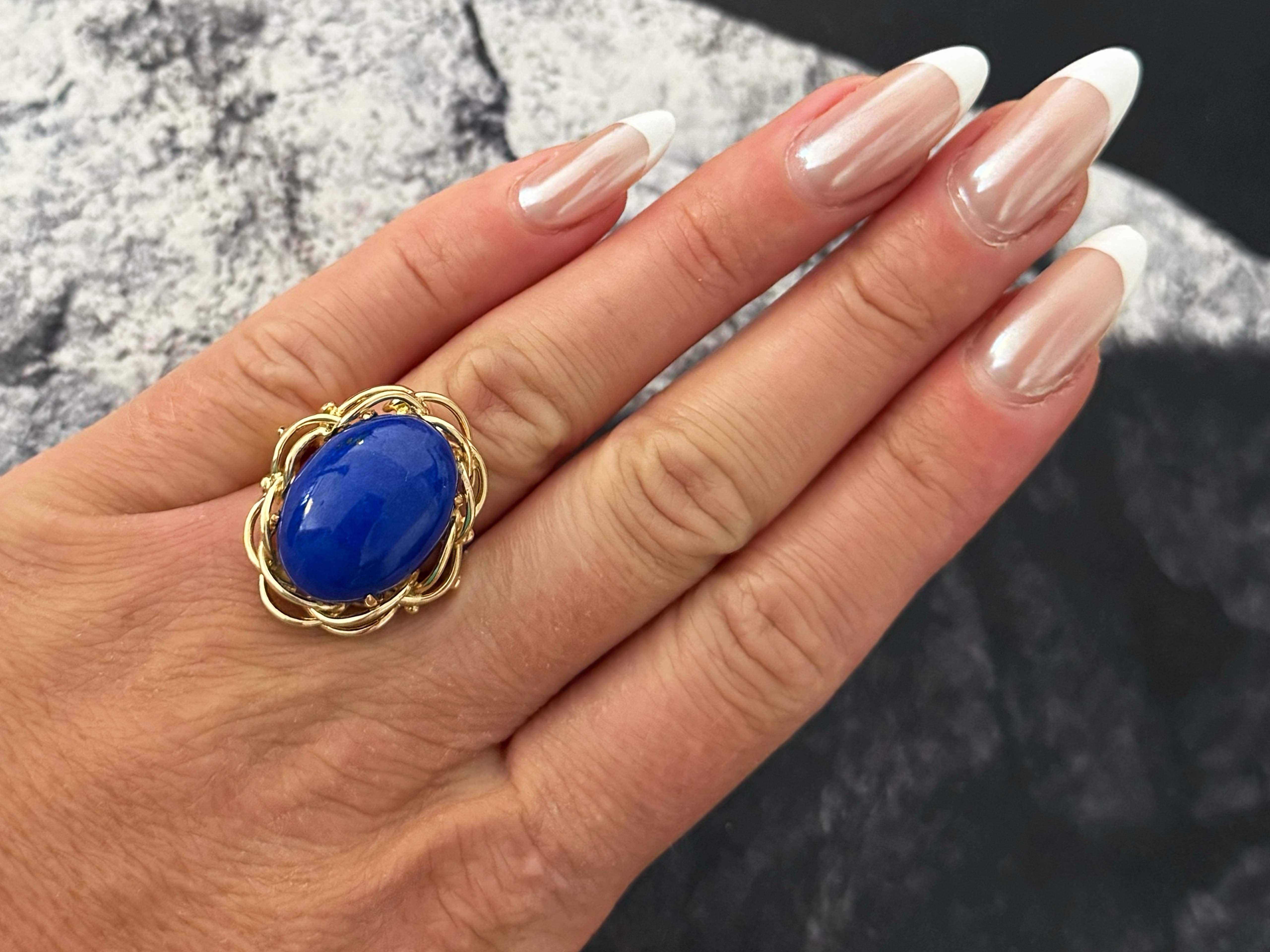 Ring Specifications:

Metal: 14k Yellow Gold

Total Weight: 11.0 Grams

Gemstone: Lapis Lazuli

Lapis Lazuli Measurements: ~20.4 mm x  15 mm x 7.1 mm

Ring Size: 6.25 (resizable)

Stamped: 