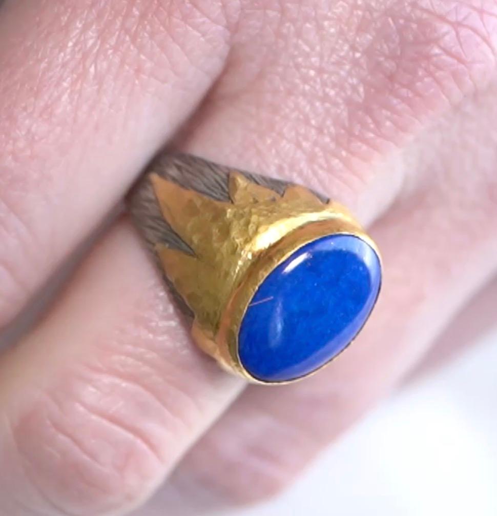 Lapis Lazuli, Large, Oval 24K Gold and Silver Textured Cocktail Ring, Handmade by Prehistoric Works of Istanbul, TurkeyRing Details: Size 7 1/4 (in stock), 24K Gold - 1.55 grams, Sterling 925 - 7 grams, Lapis - 7.5 ct

About Lapis Lazuli:
Lapis
