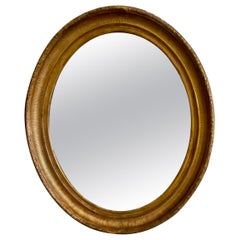 Grande specchio da parete ovale Luigi XVI del XIX secolo in legno dorato