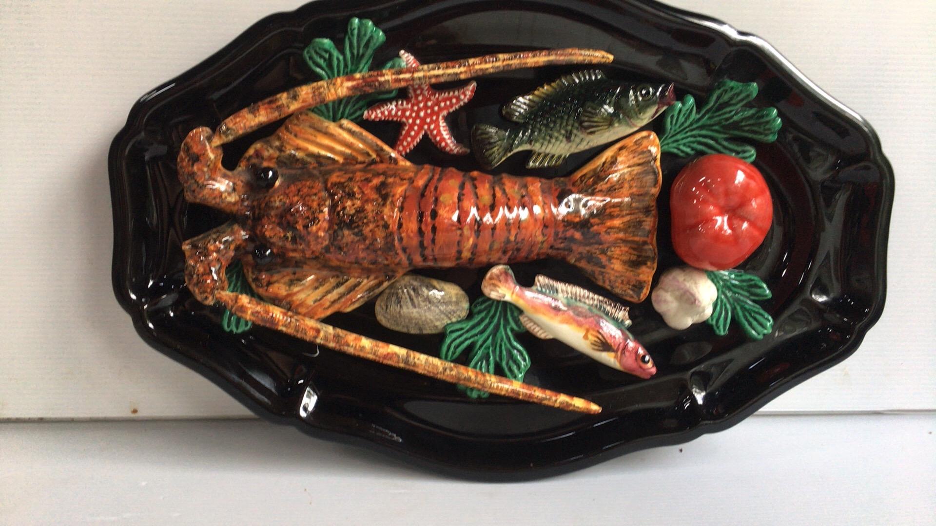 Large oval Majolica Palissy lobster and fish wall platter Vallauris, circa 1950
Measures: 17.2” by 11.6” L , 3” H.
  