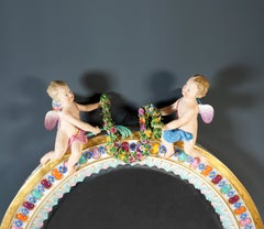 Large Oval Meissen Wall Mirror Crownd With Winged Cupids, Leuteritz, Ca. 1860