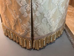 Large oval ottoman in cream and white hues