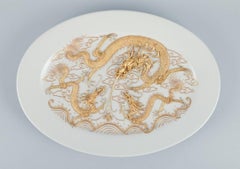 Large oval porcelain platter featuring dragons, in Versace style.