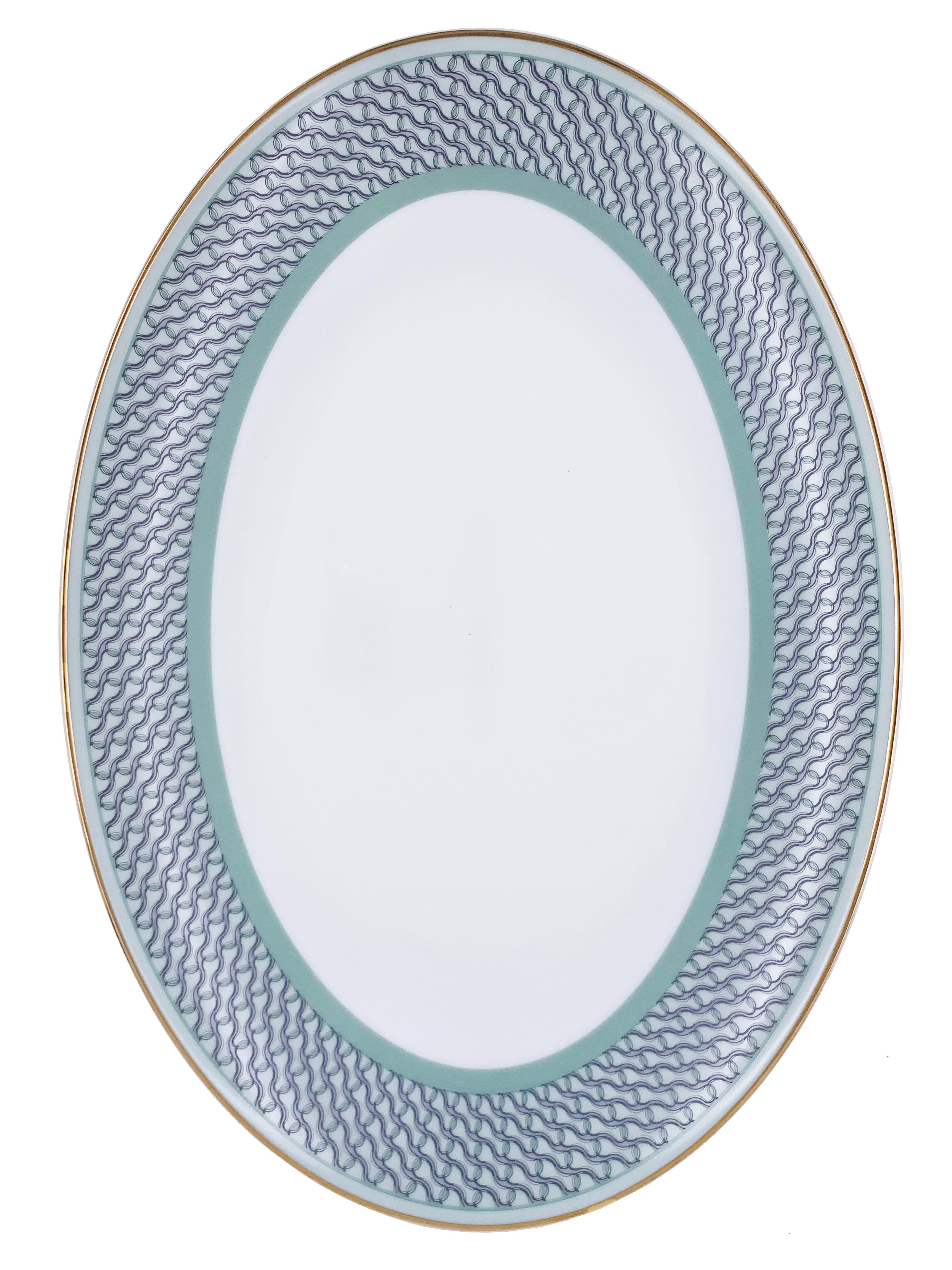 Larger quantities available upon request, with 8 weeks production time.

Description: Large oval serving plate
Color: Sage green
Size: 37 x 26 x 4H cm
Material: Porcelain and gold
Collection: Mid Century Rhythm