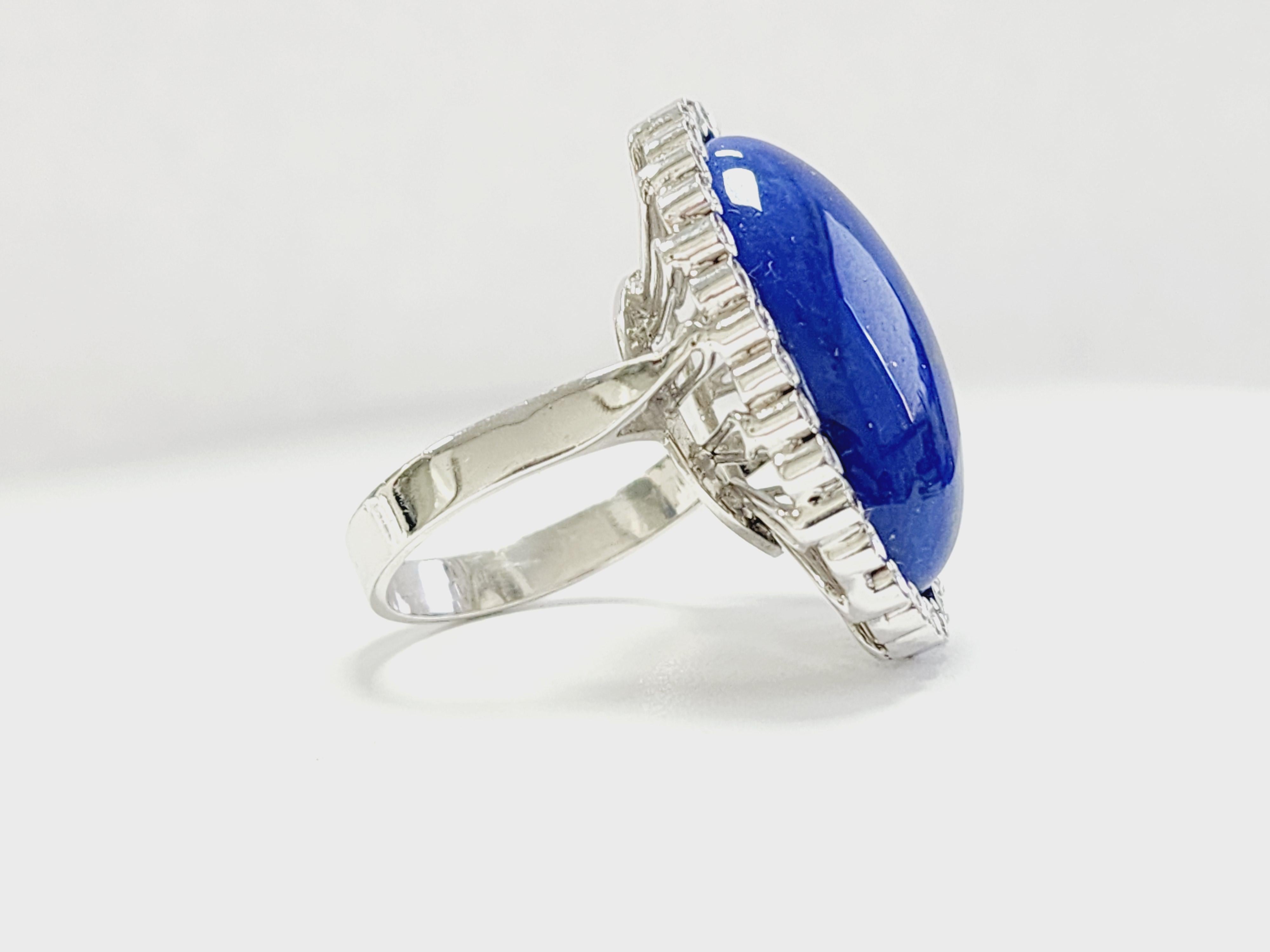 Gorgeous and unique large oval shape lapis surrounded by tube set diamonds on 18 Karat white gold ring.
0.70 total carat diamonds 
Ring size 8.

*Free shipping within the U.S.*