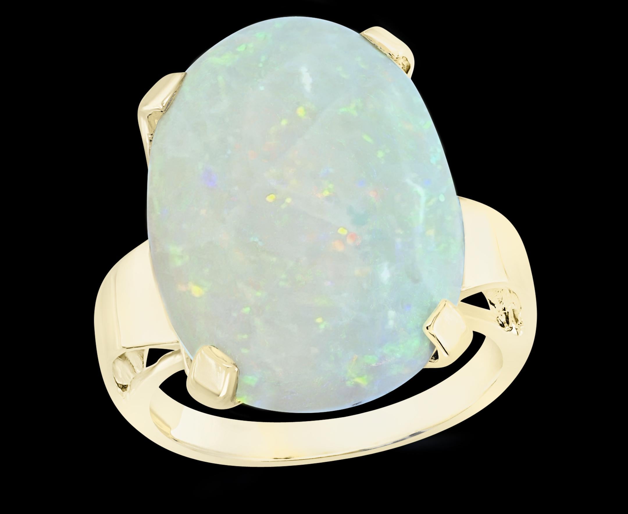 Large Oval Shape Opal Cocktail Ring 14 Karat Yellow Gold, Estate, Closeout 
Oval  Natural Opal  Cocktail Ring   
14 Karat Yellow  Gold Estate
 Approximately 9-10 Ct
A classic, Cocktail ring 
Size of the opal 10 X21 MM
Ring is on Clearance as I am 