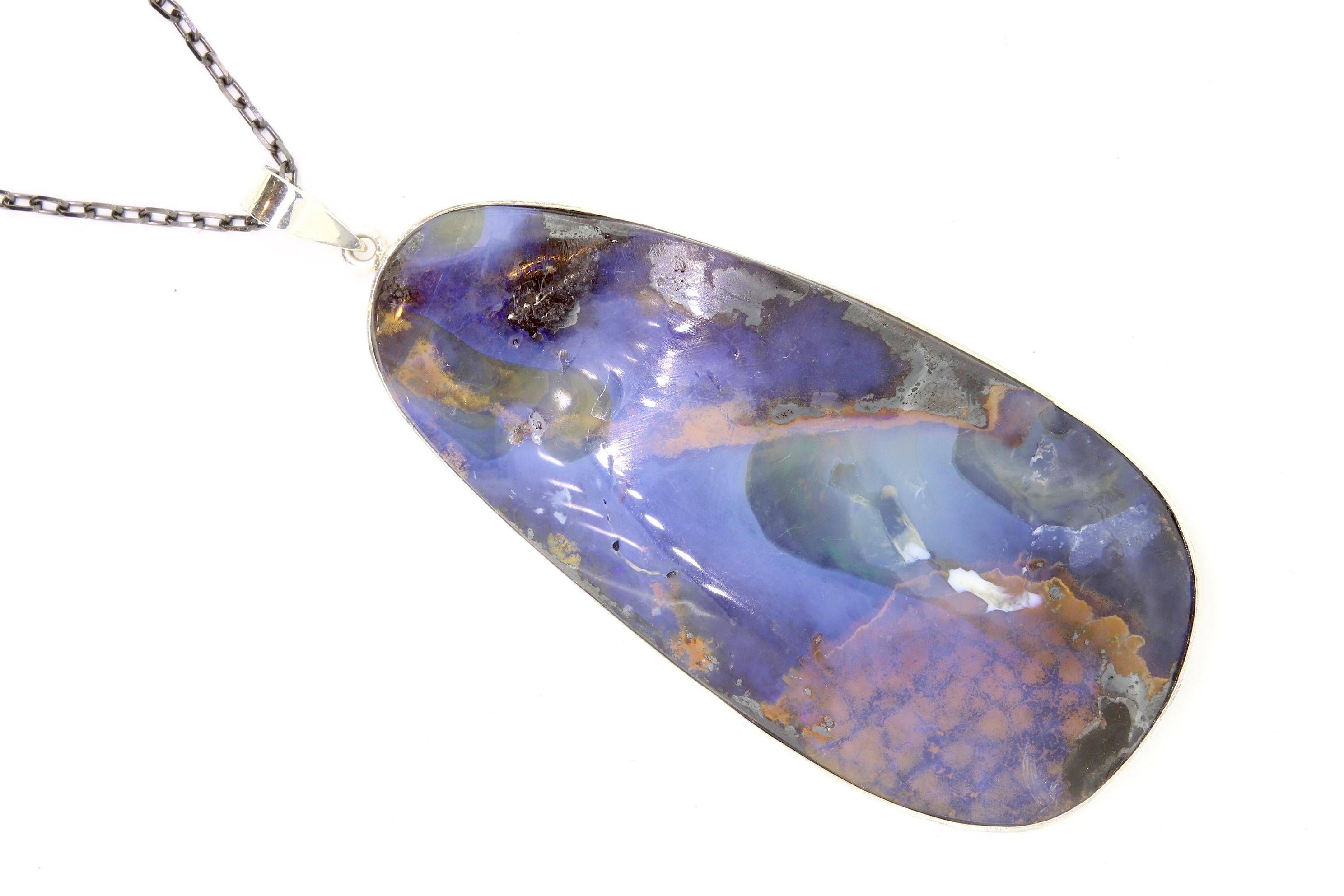 A unique piece, this Opal is a true showstopper! 

Material: Silver
Center Stone Details: 1 Opal at 65 x 30mm
Chain: 16 inch

Fine one-of-a-kind craftsmanship meets incredible quality in this breathtaking piece of jewelry.
