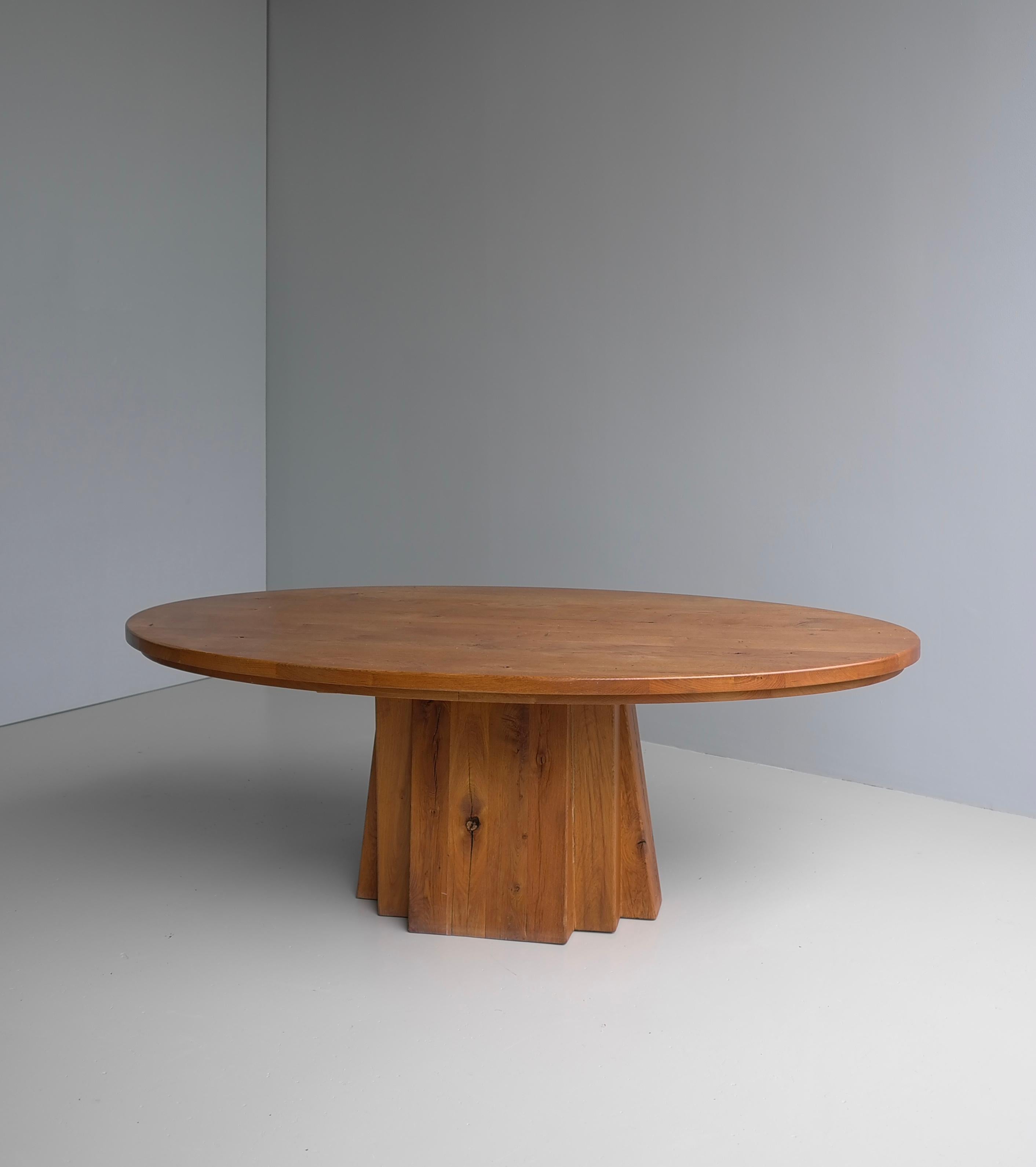 Large Oval Solid Oak Dining Table in style of Pierre Chapo, France circa 1970

This large Oval table is made from solid Oak with a unique Sculptural wooden base, layered large pieces of Oak wood. Very heavy and solid piece, lovely texture from the