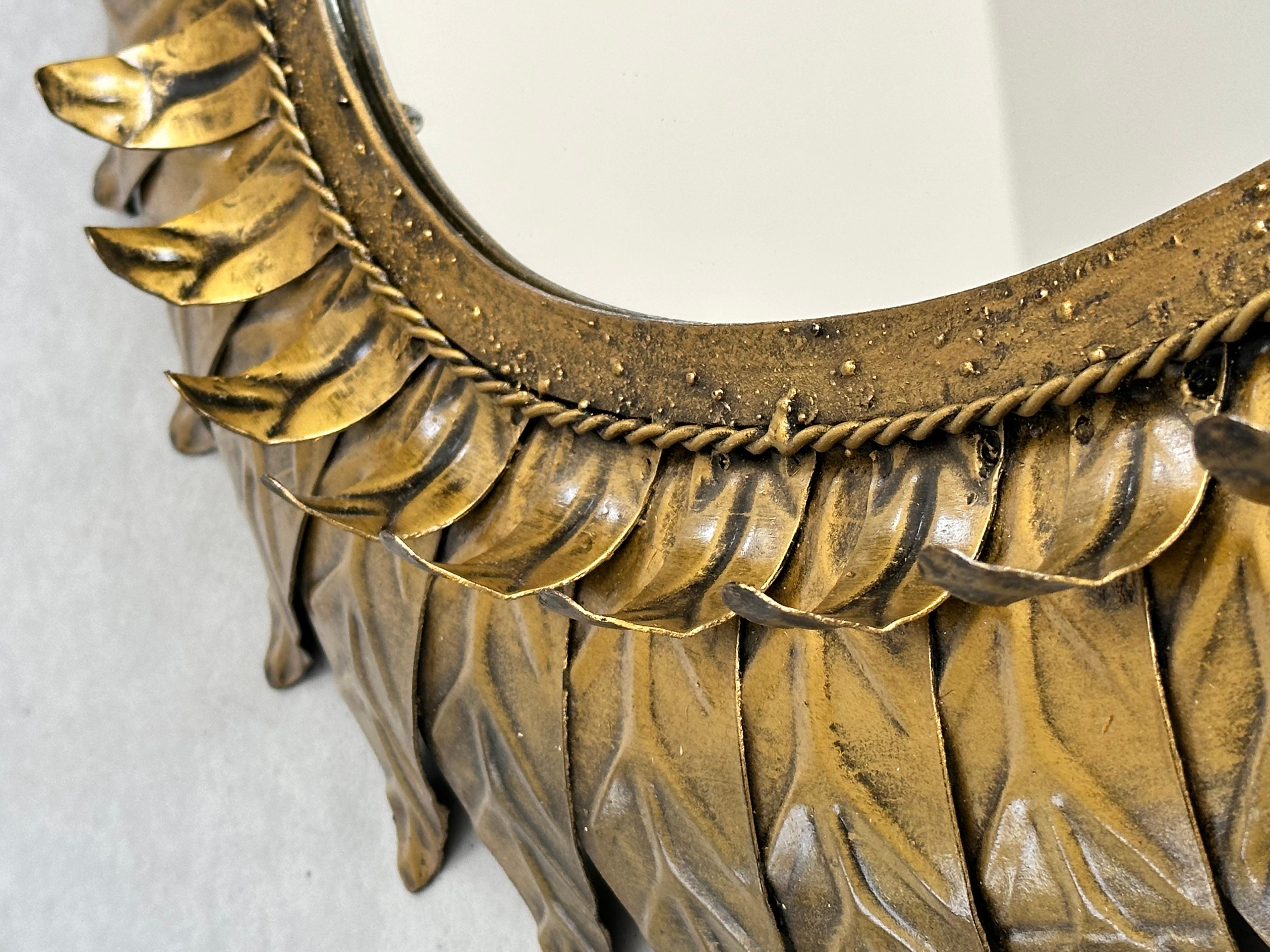 Mid-20th Century Large oval sunburst mirror, framed with gold-colored metal leaves, Spain 1960 For Sale