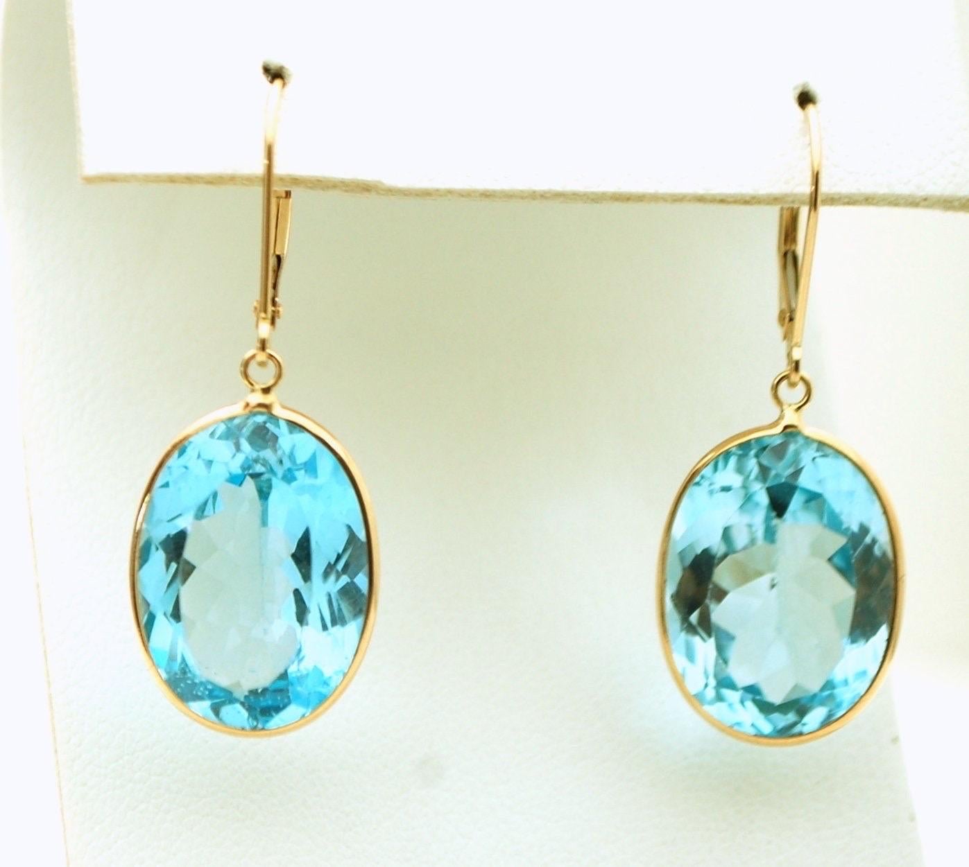 Lever back cocktail earrings with large oval topaz gemstones in 14KT yellow gold. Topaz is approx. 12mm each.

Company policy every item has to have a certificate of authenticity before it leaves our jewelry store.


ABOUT US
We are a family-owned