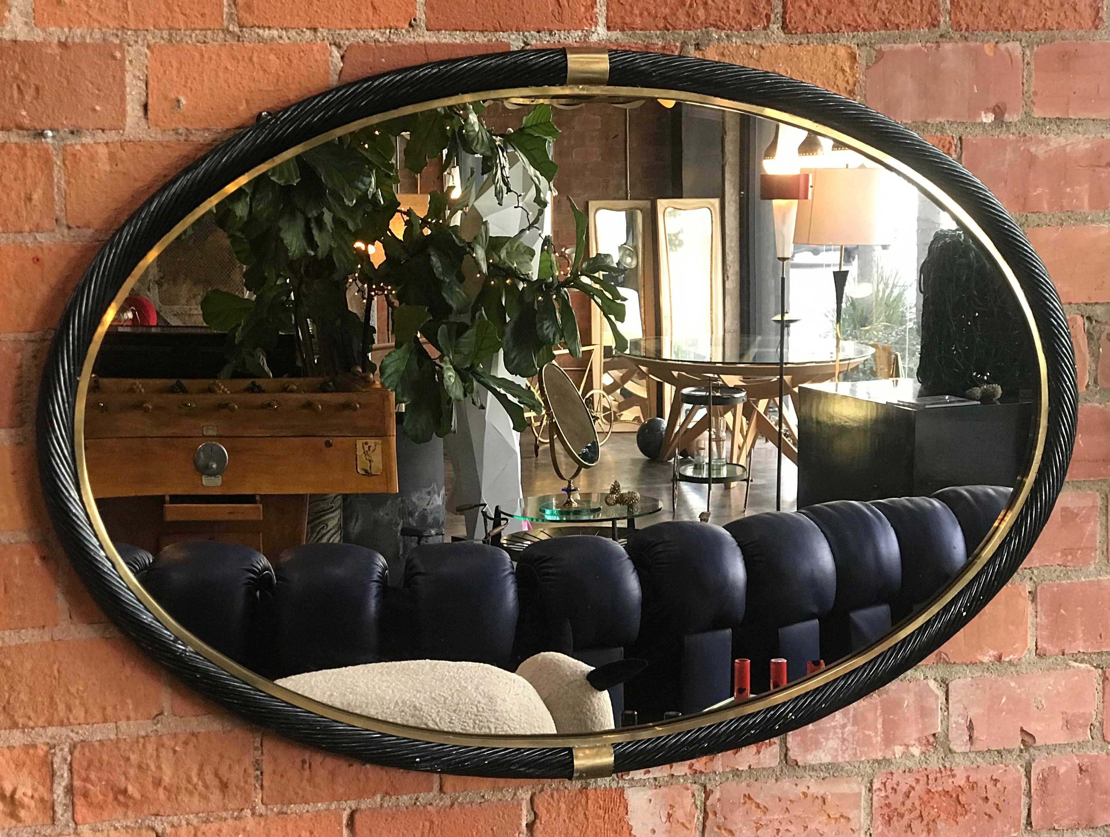 Large oval torch-on frame wall mirror brass, Italy, 1950s.
Hang both vertically and horizontally, as you like it.