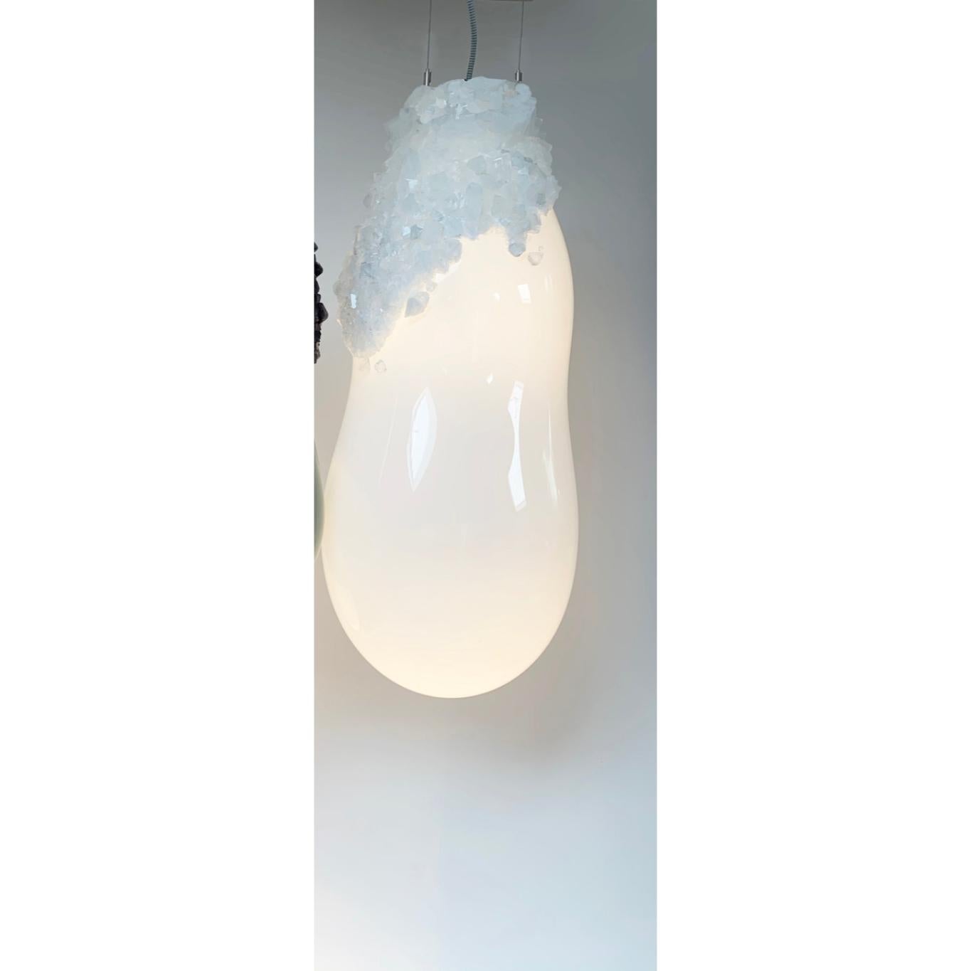 Large overgrown bubbles by Mark Sturkenboom and Alex de Witte
Dimensions: H 76 cm 
Material: Mouthblown glass, natural grown crystal, dimmable led, Colour White or grey black
Ceiling ornaments can be produced in crystal to extend the Overgrown