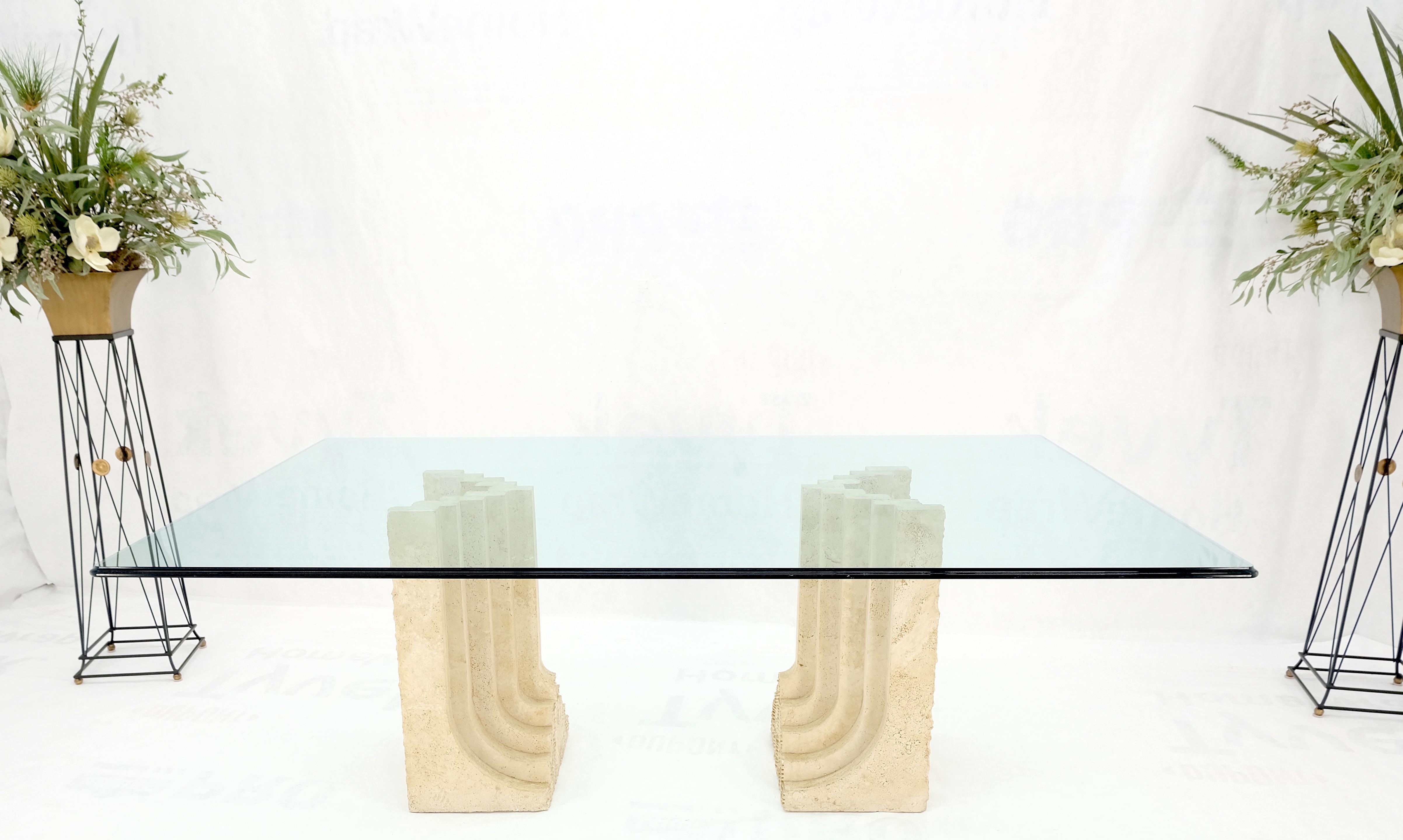 Large oversize wide rectangle shape glass top travertine dining conference table.
Double carved waterfall shape travertine pedestals base.