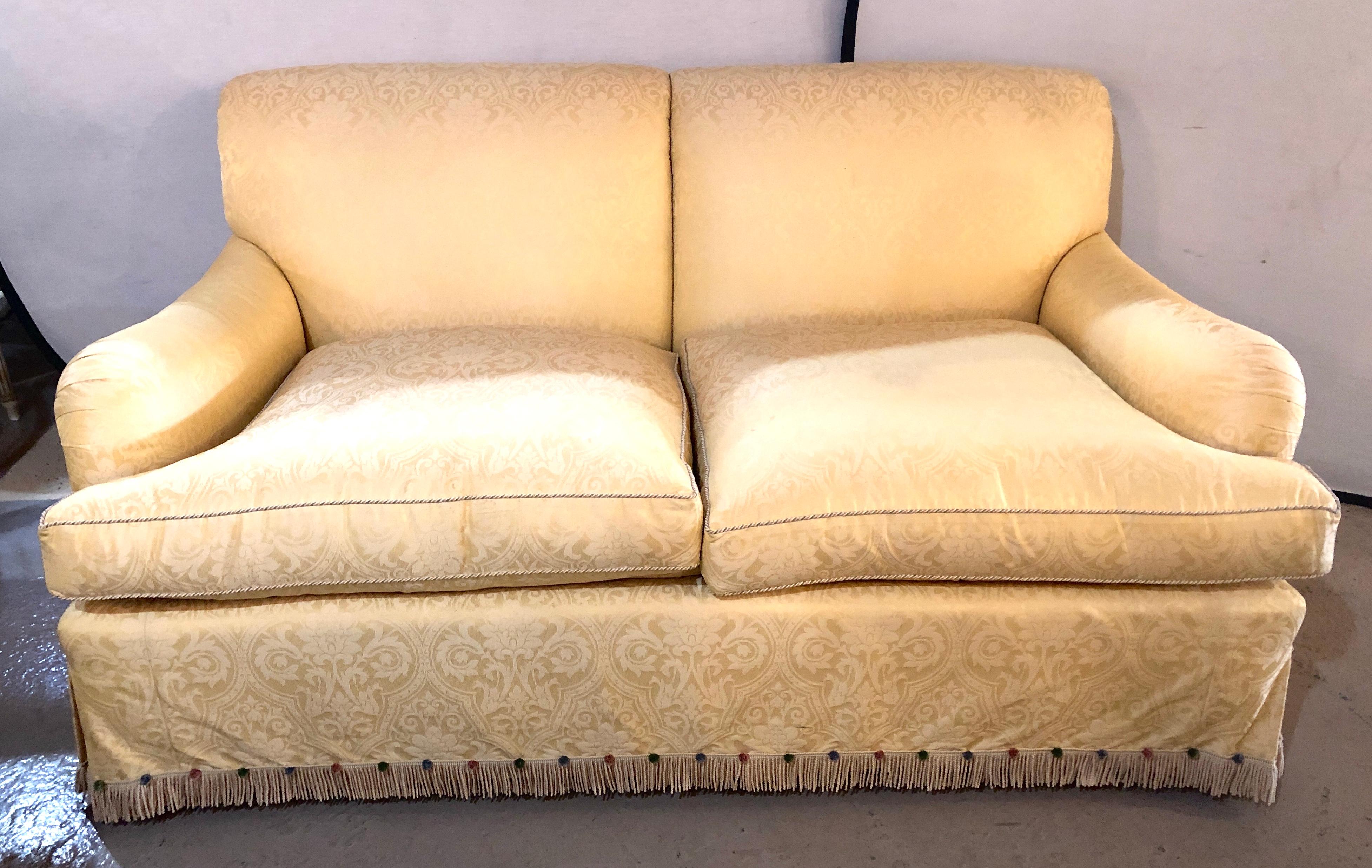 Large overstuffed settee in fantastic damask fully lined upholstery by O'Henry House ltd. Directly from a Mansion in Brownsville comes this fine very sleek and stylish settee in the most wonderful fabric.