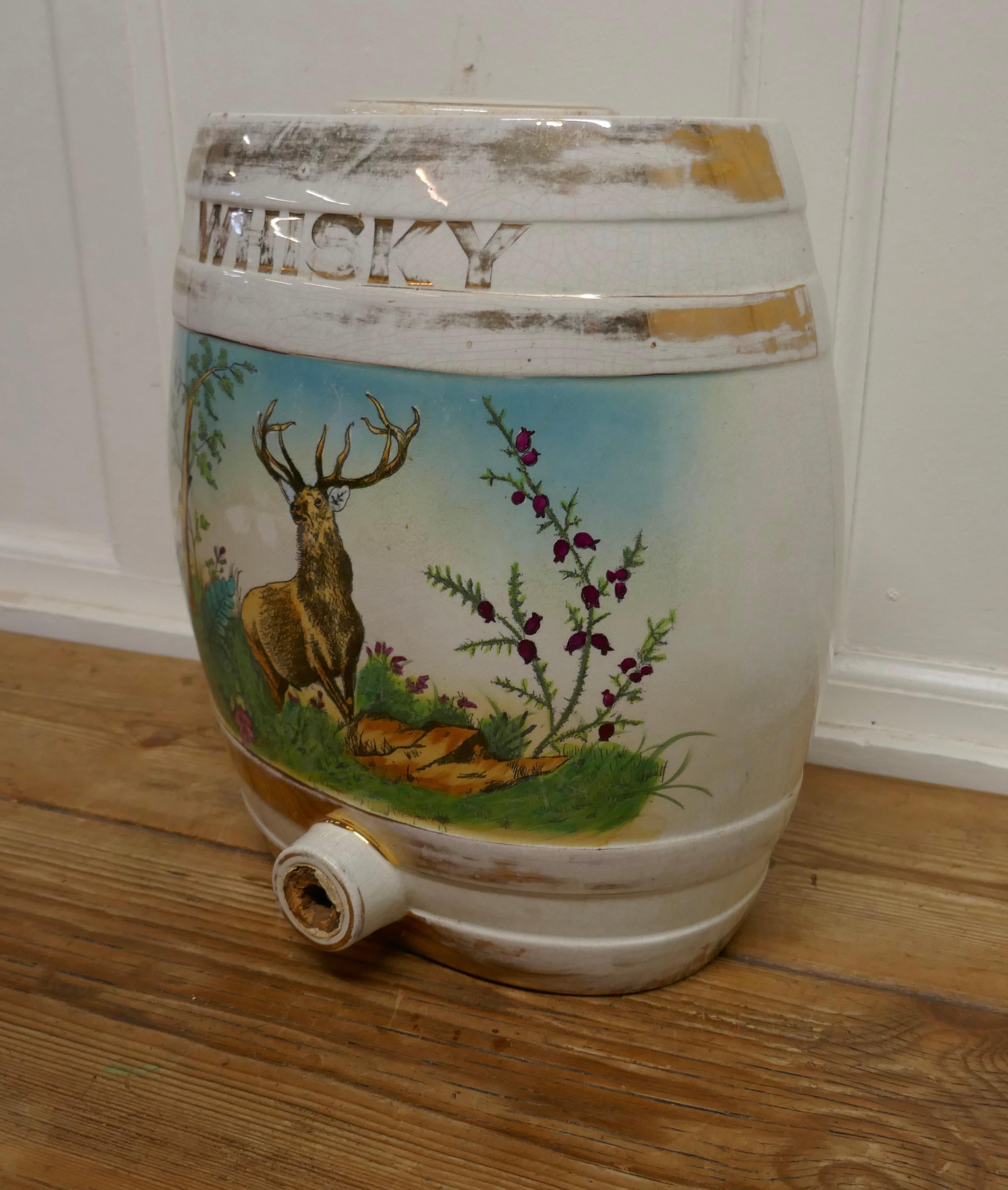 Large painted ceramic scotch whiskey barrel, stag at bay

An attractive and colorful piece, in good used condition, the ceramic lid has been repaired
The barrel, is 14” tall, 12” wide, 8” deep
GB369.