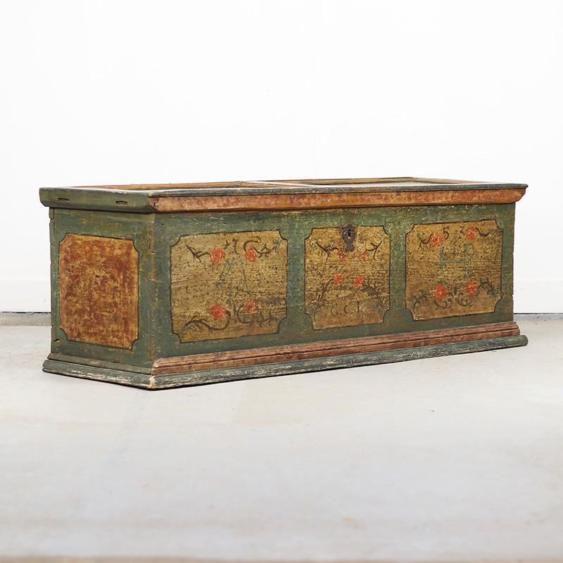A unique antique bridal chest dating from 1753, from southern Germany. This piece of furniture is attractively and traditionally painted in a soft light blue with floral motifs. This original 18th-century paintwork is weathered and worn, giving the