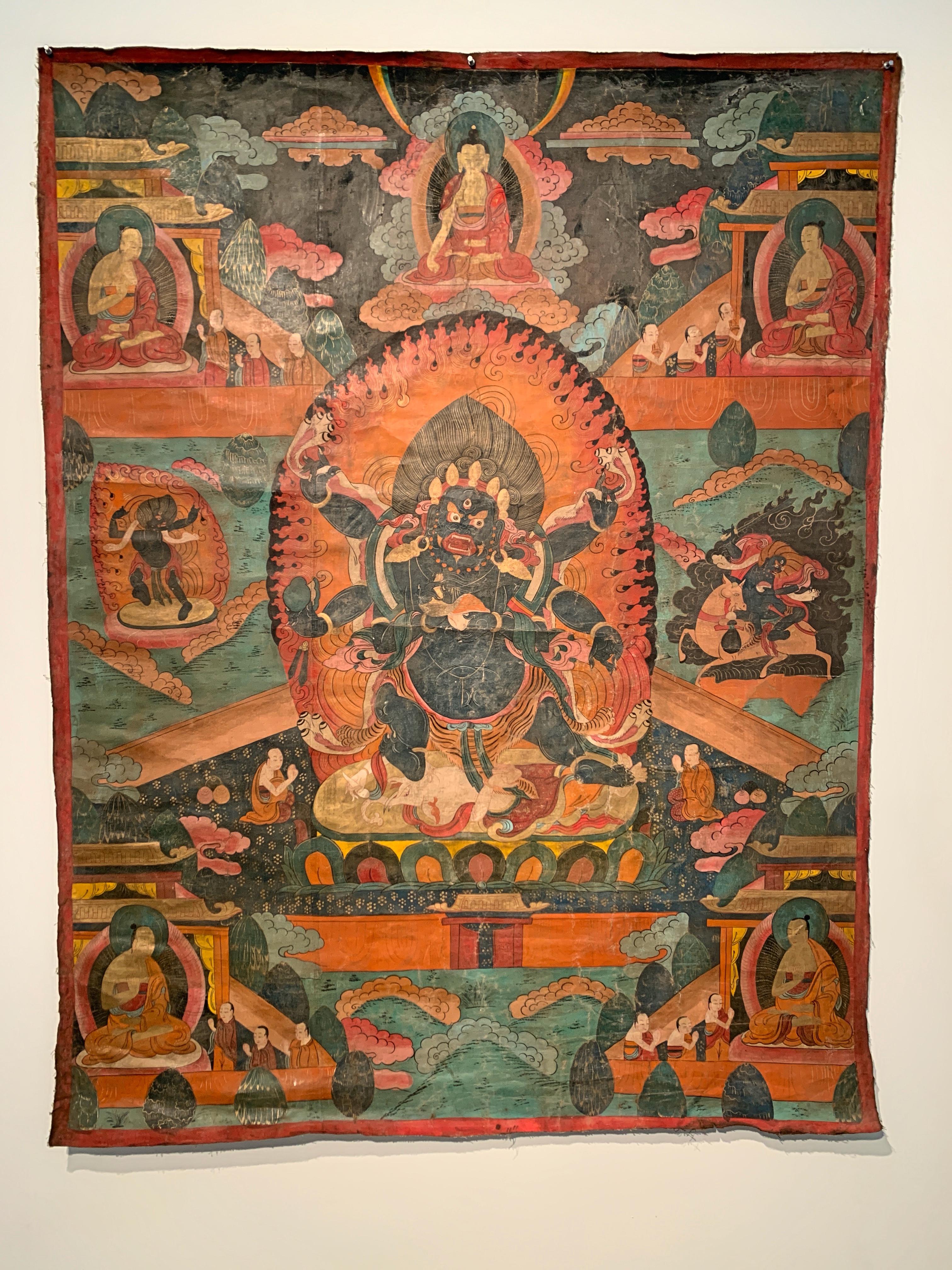 A large and wild Mongolian painted thangka of the great Dharmapala Mahakala, pigment on canvas, early 20th century, Mongolia. 

Mahakala, the great protector of Buddhist wisdom and wrathful emanation of Avalokiteshvara, is portrayed in his fierce,