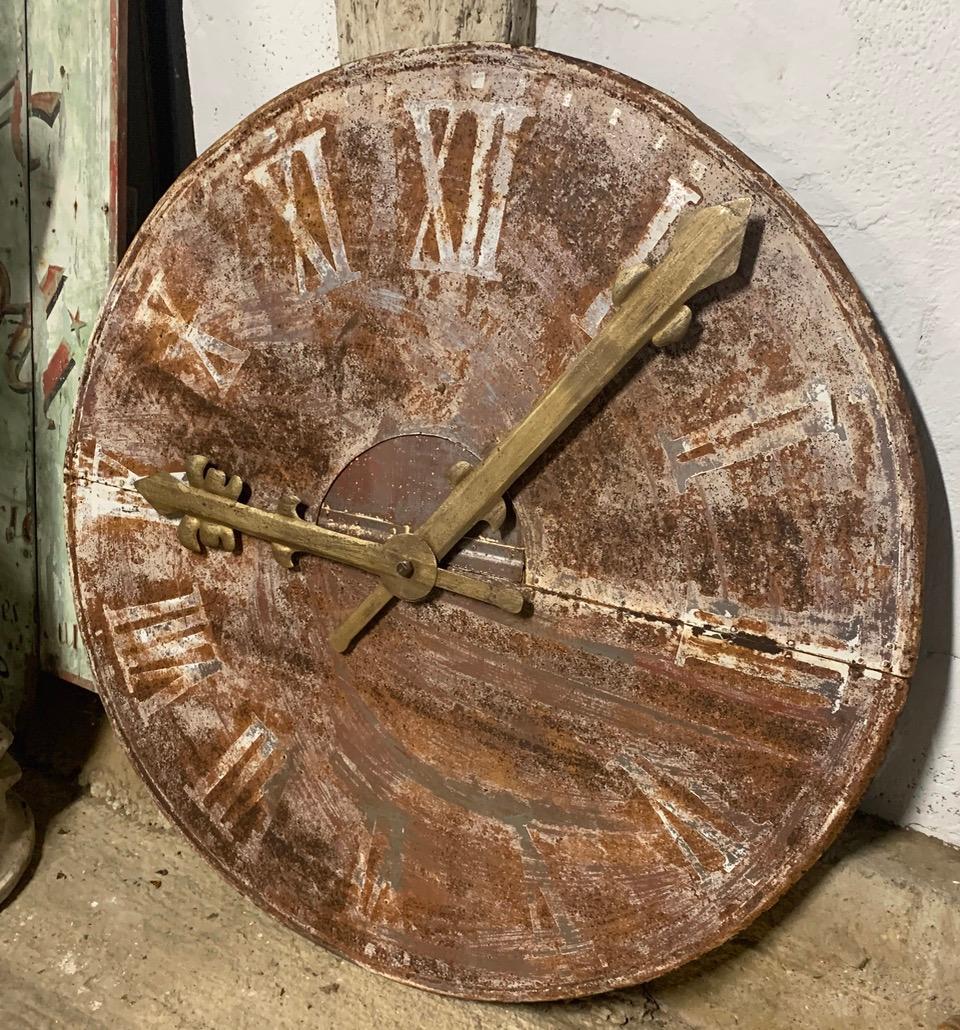 A large early 20th century painted metal tower clock face from Belgium. With original weathered paint and hands. A nice decorative piece.