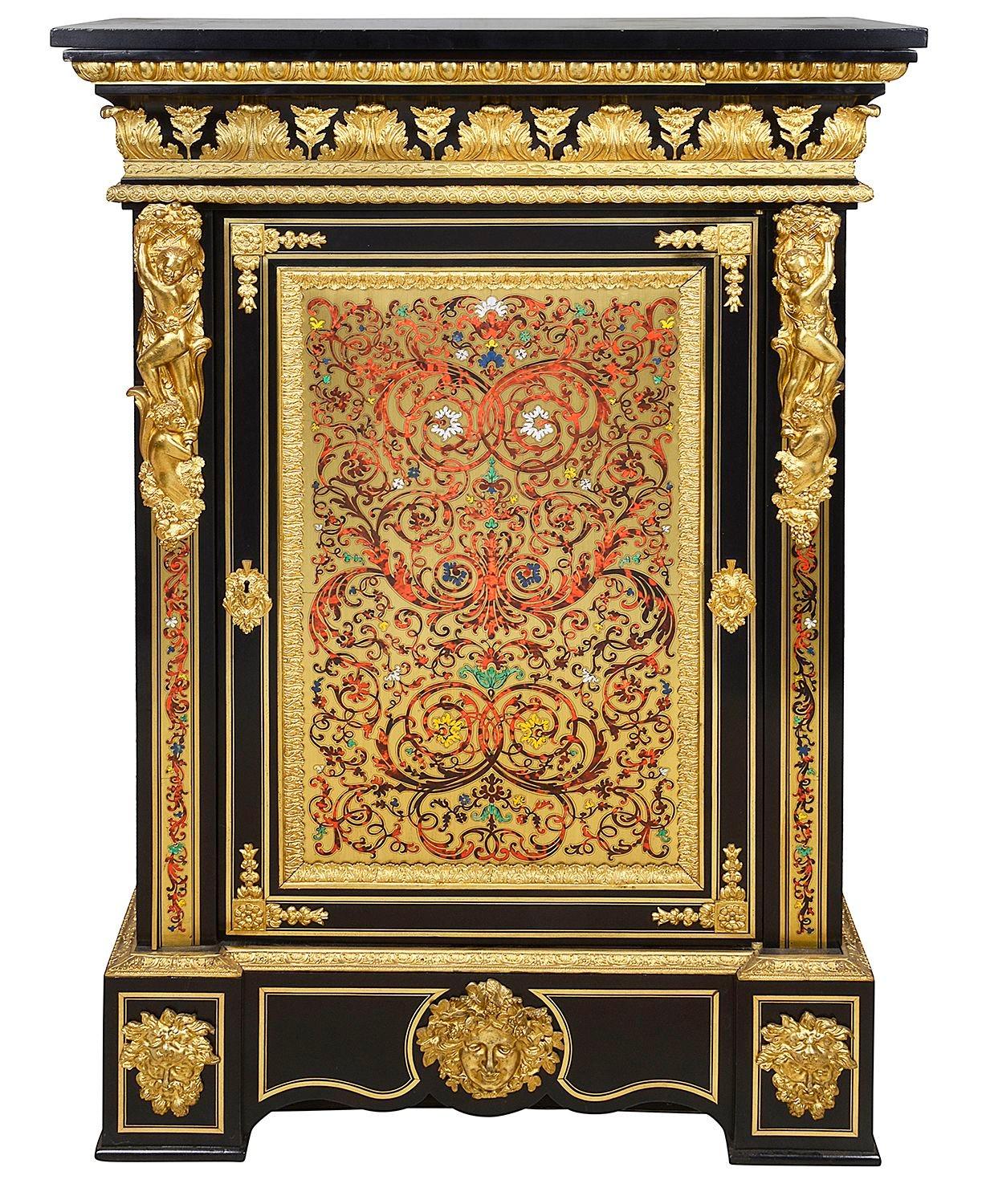 A large and impressive pair of 19th century French Boulle Tortoiseshell inlaid side cabinets, each with their original Belguim black marble tops, wonderful gilded ormolu mounts and mouldings. A pair of classical putti each holding baskets of fruit.