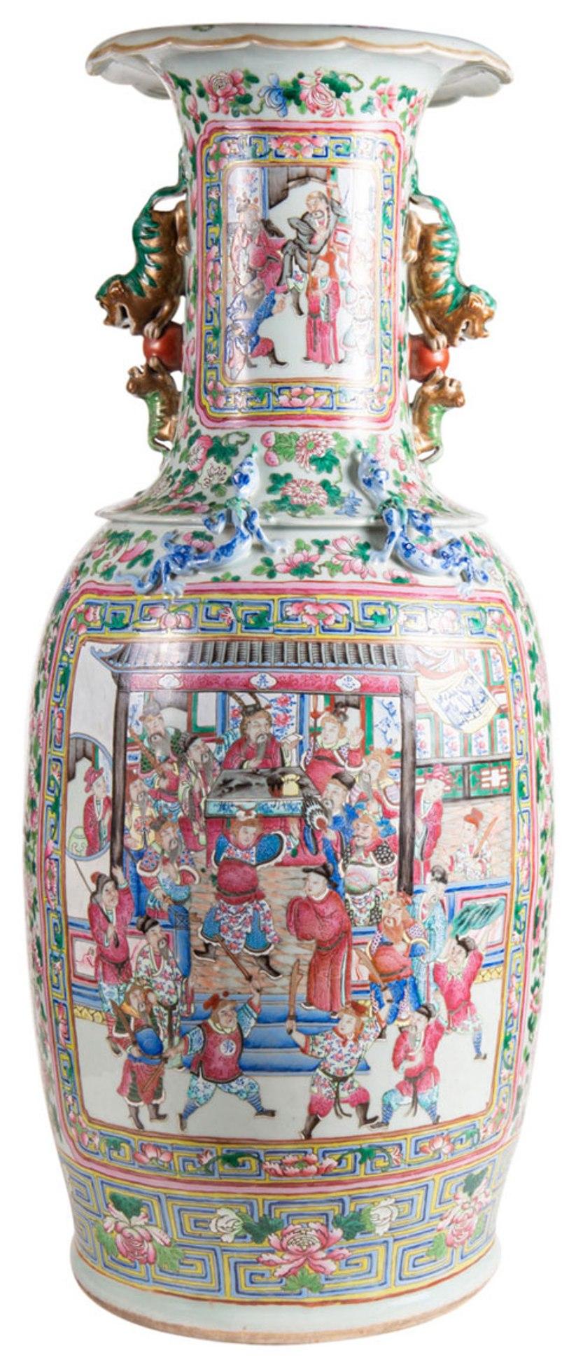 A very impressive pair of 19th century Chinese Famille Rose floor standing vases, each green and pink ground with exotic birds and flowers. Inset painted panels depicting courtiers, scholars, musicians and warriors. Measures: 89cm (35