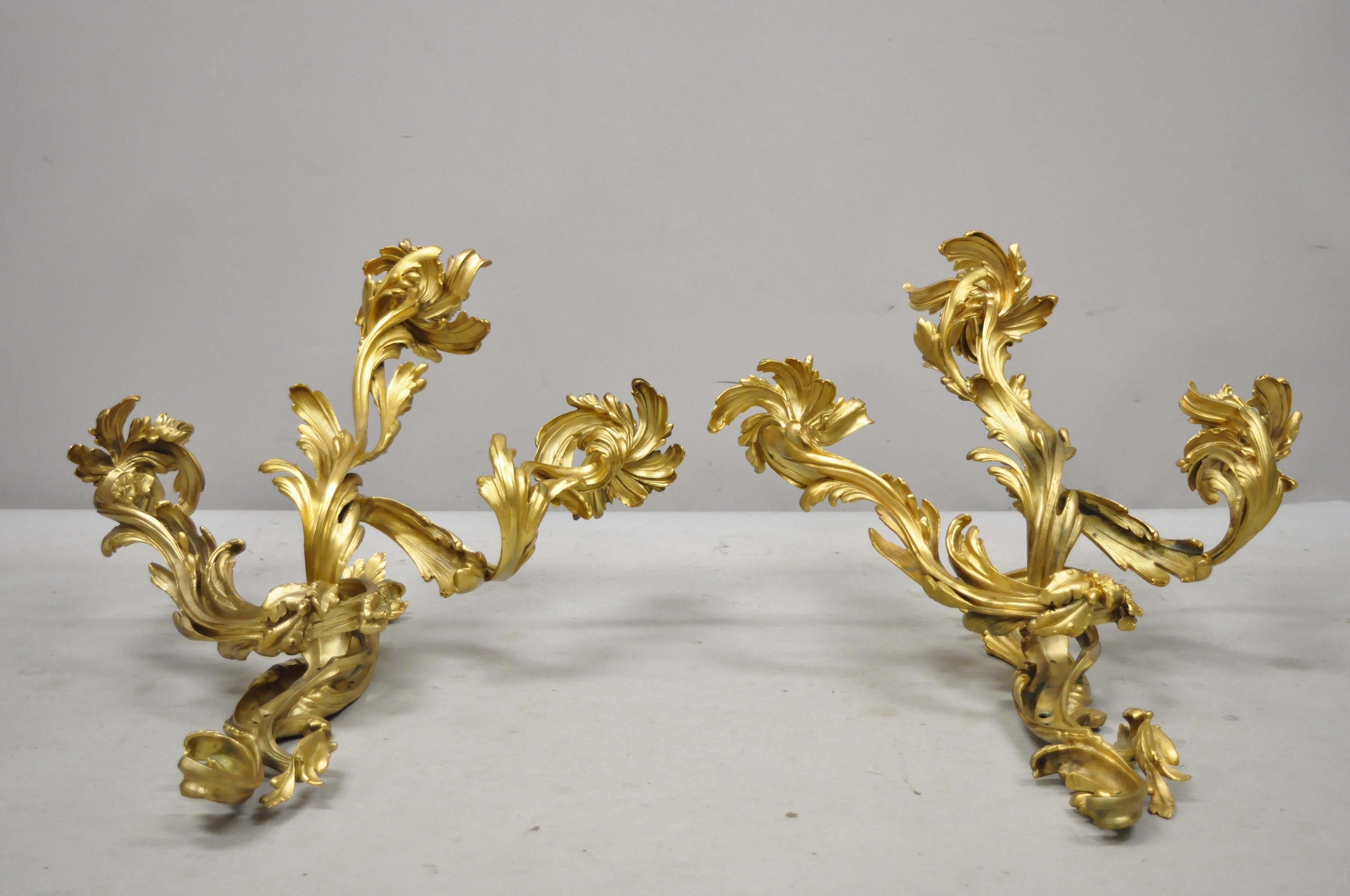 Large pair of antique French rococo gold gilt doré bronze candle wall sconces. Item includes large impressive bronze forms, attractive doré bronze gold gilt finish, 3 candle holders each, fancy acanthus scrollwork design, very nice antique pair,