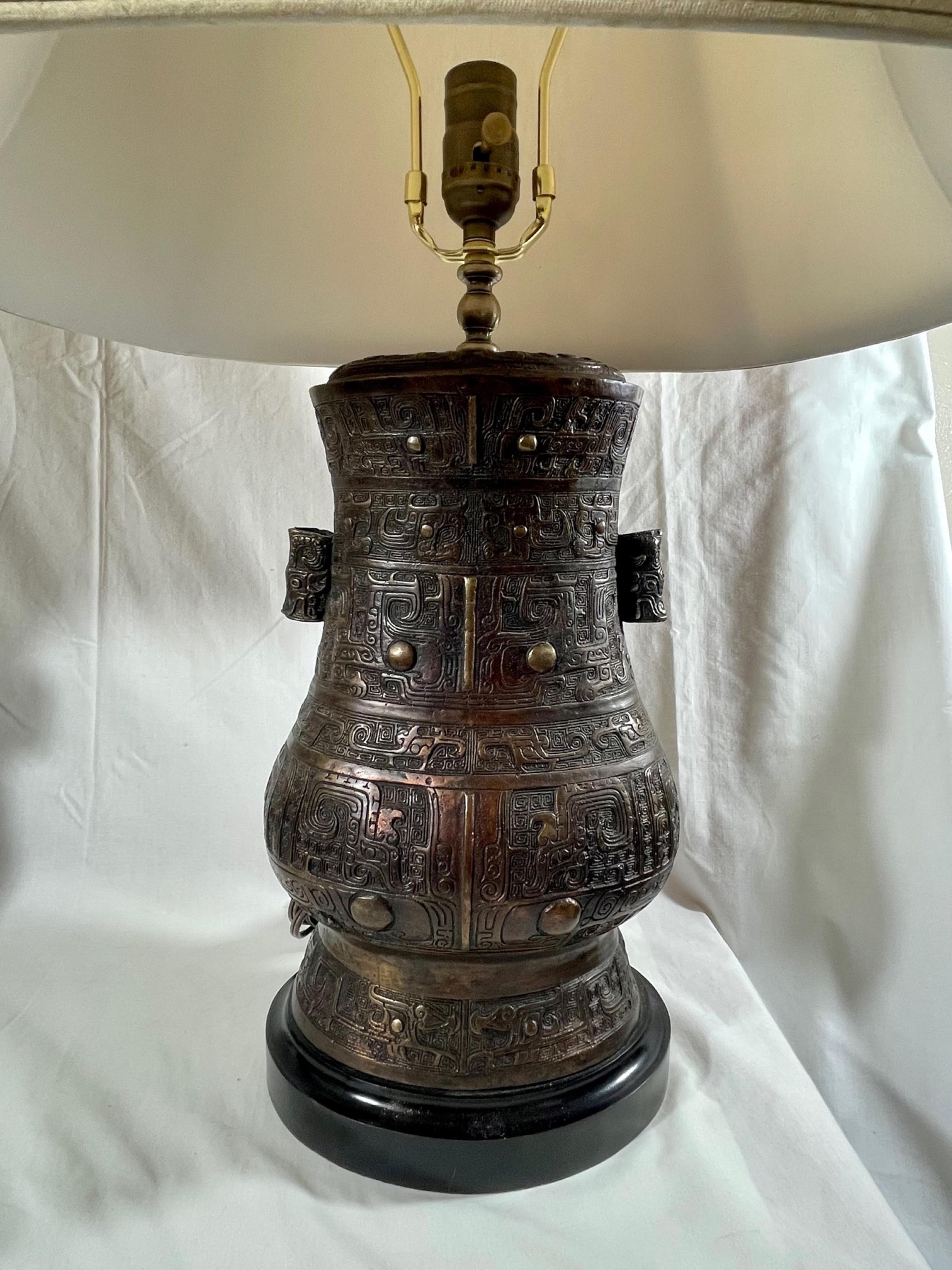 Large Pair Chinese Archaistic style lidded bronze vases - Urn lamps

Beautiful matching pair of bronze cast early 20th century Chinese vases in the archaic style. The lidded heavy bronze urns are cast by master craftsmen in extraordinary quality.