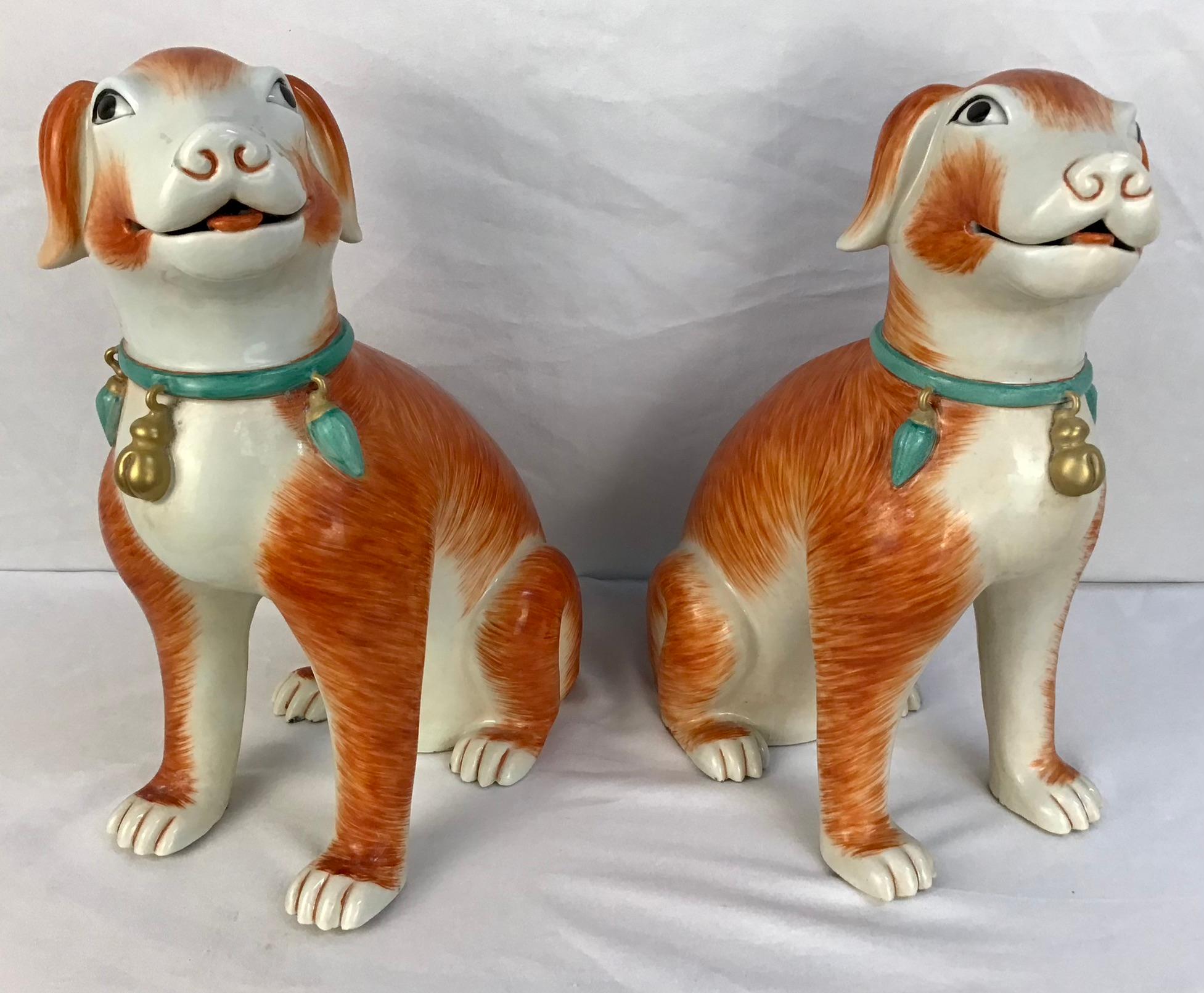 Large pair of Chinese Export style seated dogs. A true pair one facing the right, the other to the left. Exquisitely modeled and painted, with blue and gold gilt collars.
Excellent condition.