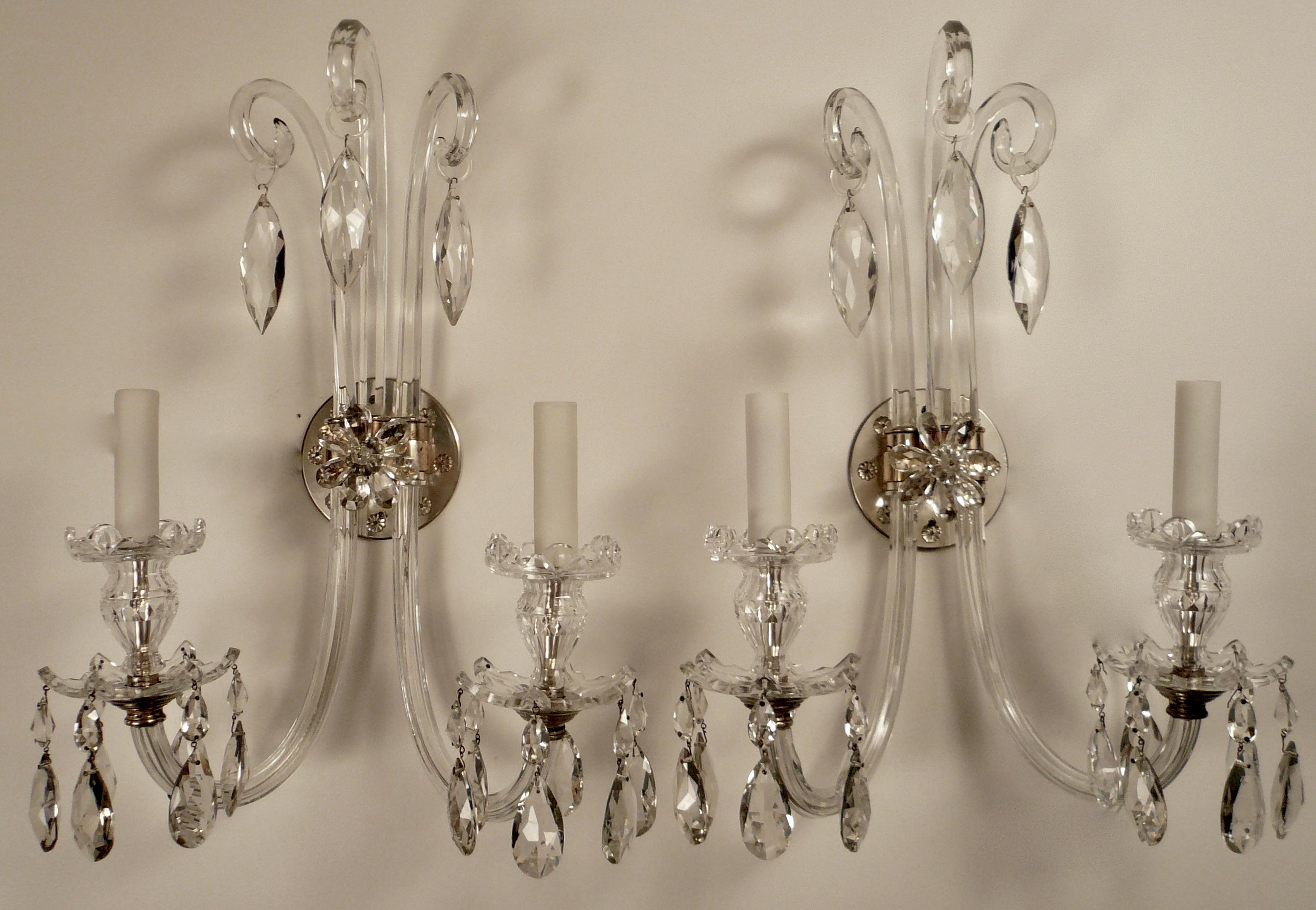 This beautiful pair of English Neo-Classical sconces feature panel cut J-arms, and Van Dyke style bobeches and candle cups. The pear shaped pendants are of the finest quality.