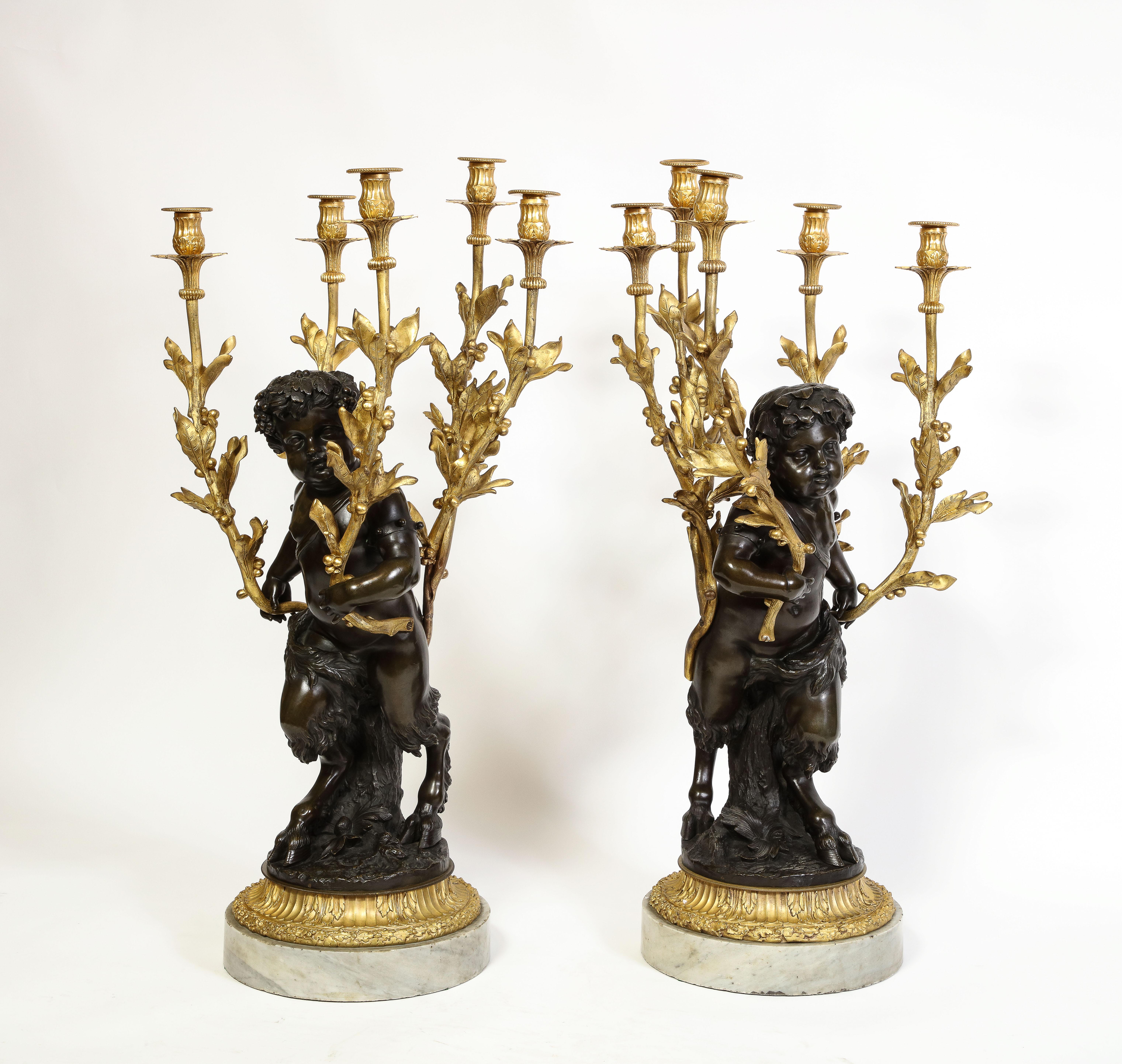 Large Pair French Patinated & Dore Bronze Putti Form Candelabra on Marble Bases In Good Condition For Sale In New York, NY