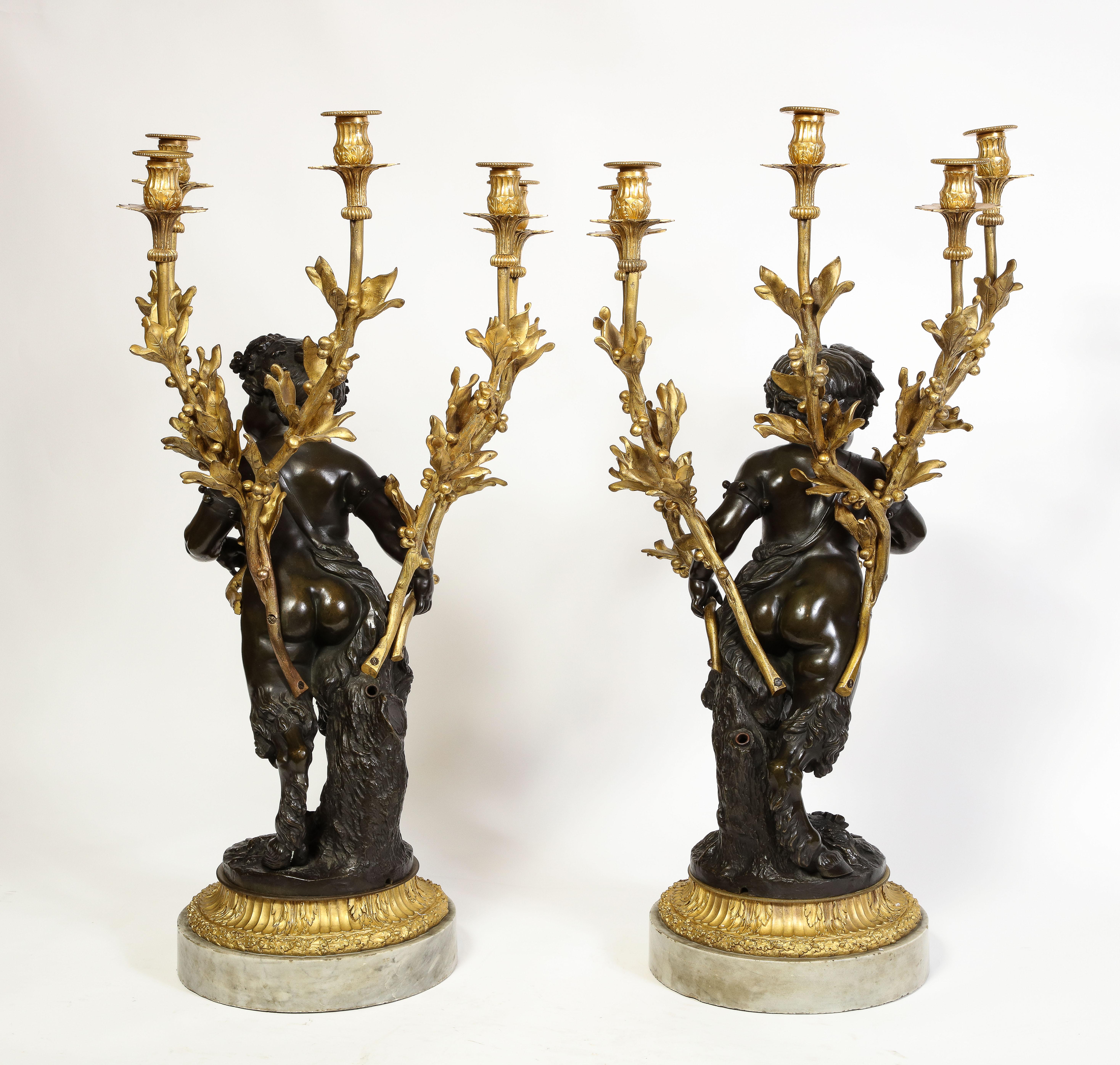 Carrara Marble Large Pair French Patinated & Dore Bronze Putti Form Candelabra on Marble Bases For Sale