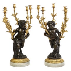 Large Pair French Patinated & Dore Bronze Putti Form Candelabra on Marble Bases
