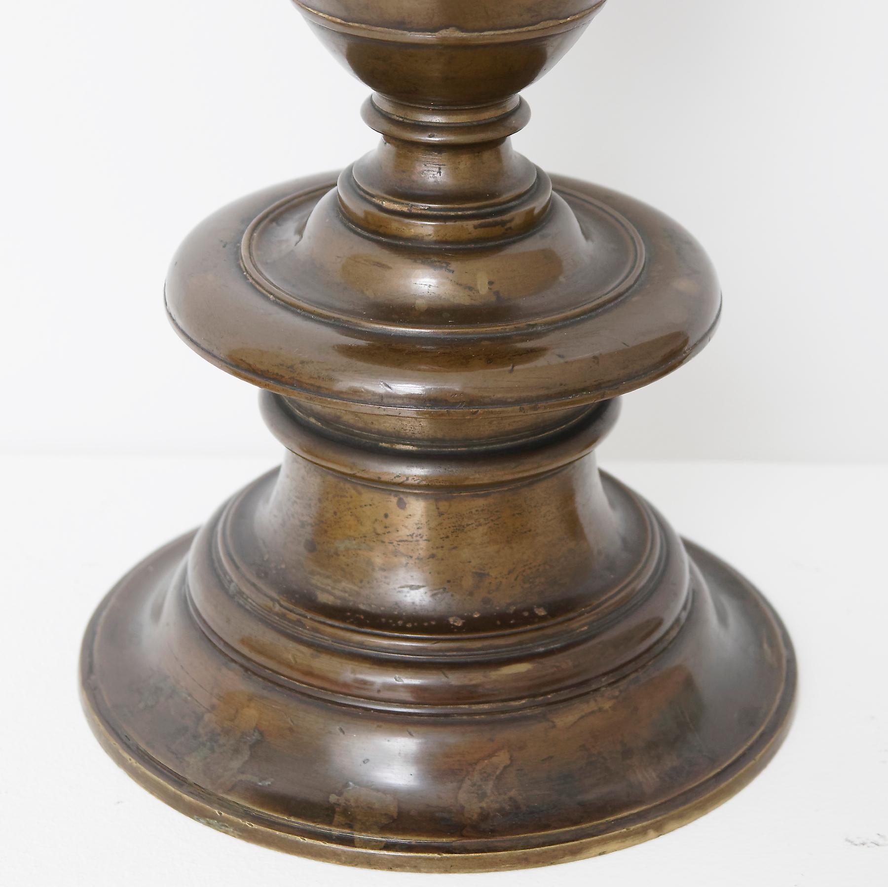Each with inverted drip pan above a baluster-shaped stem terminating in turned circular base.

Provenance: Collection Dr. Rudolf Ergas, Florenz. Auction Hugo Helbing, München, 1931, Lot 19.