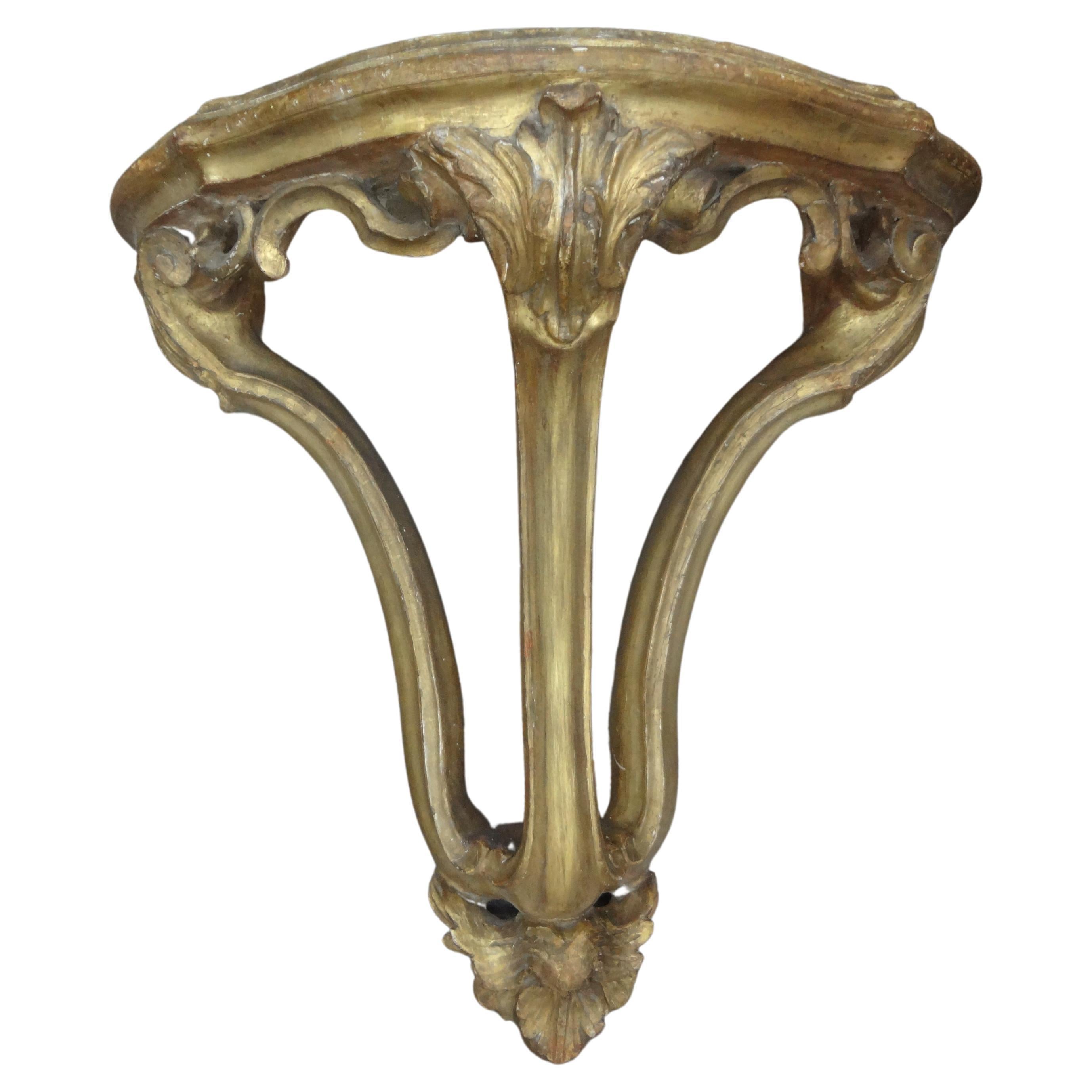 Large pair of 18th century Italian Baroque giltwood wall brackets.
These gorgeous large scale 18th century Italian giltwood wall brackets, wall consoles or wall shelves are statement pieces. Appropriate scale to accommodate a large pair of vases,
