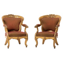 Grande paire de fauteuils italiens en bois doré du XVIIIe siècle