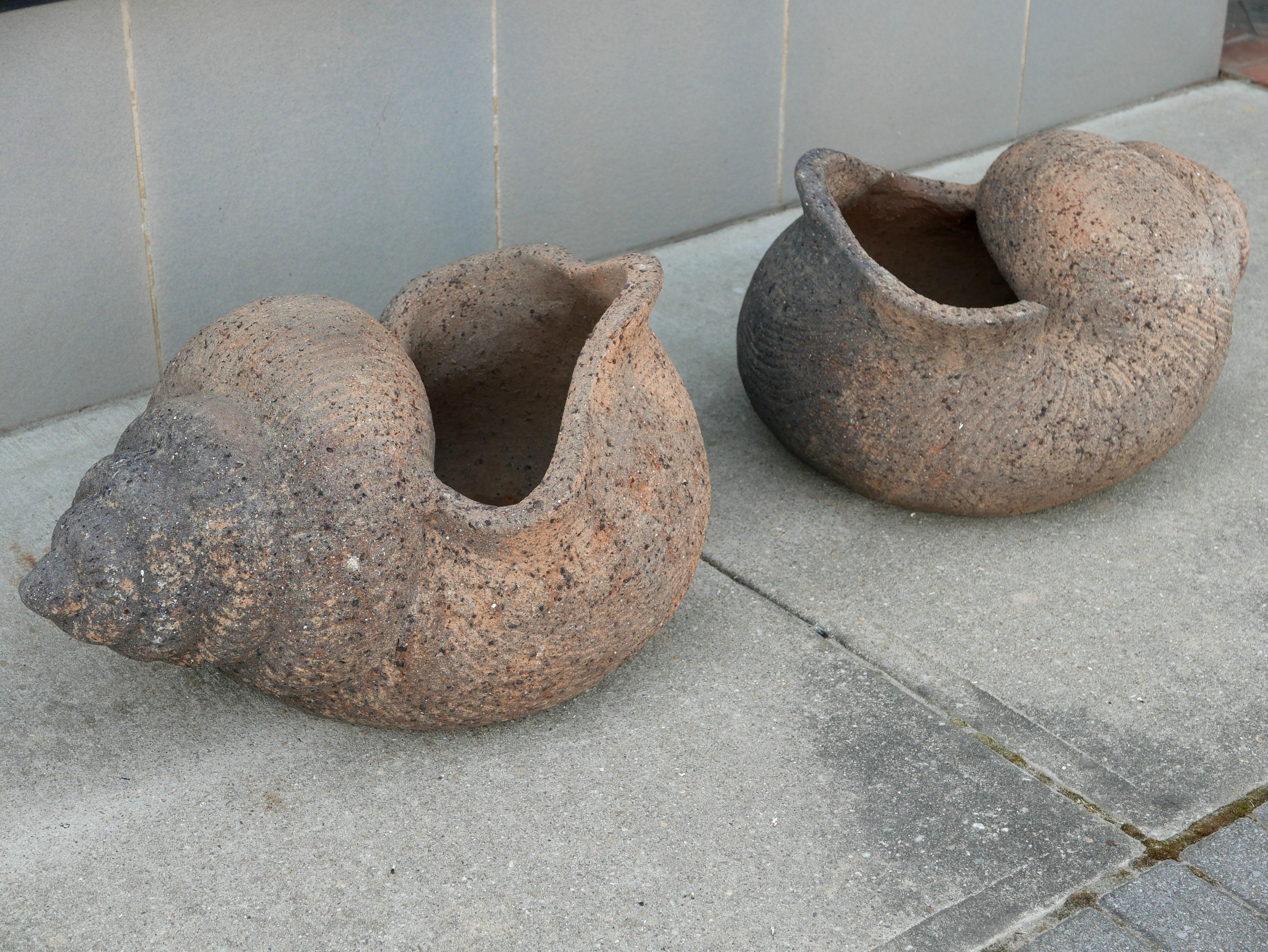 A stunning set of large 1930s terracotta shell-shaped planters with gorgeous age acquired patina. Most likely from a large resort as I've never seen anything like this before.