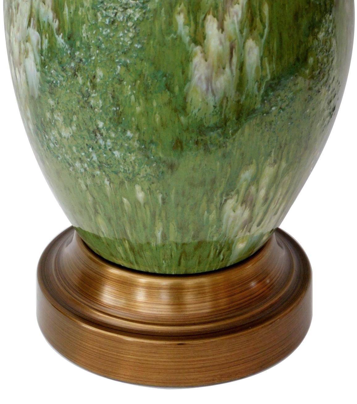 Each ovoid lamp of impressive size with ribbed neck above a tapering body; all in a rich drip glaze of celadon and pale blue; measures: height 23