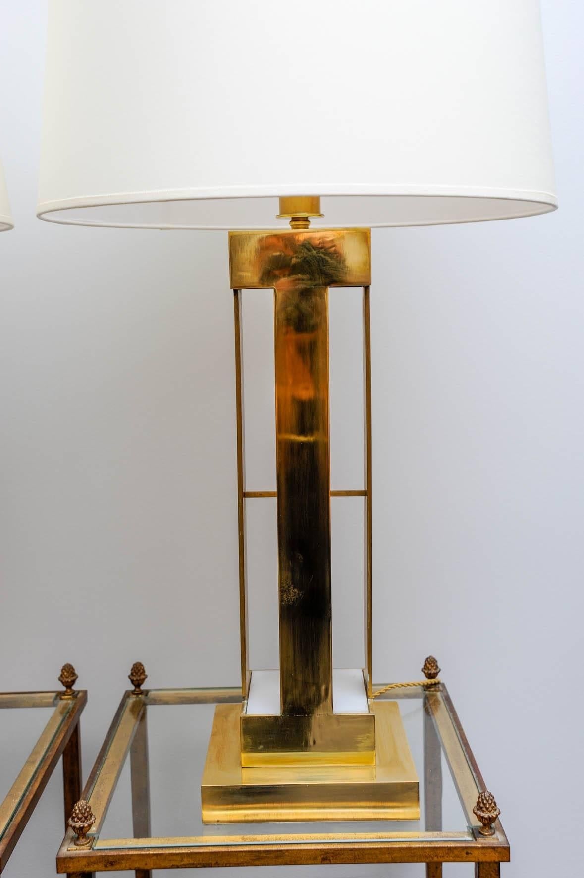 Rare and elegant pair of large lamps, heavy brass and perspex.
With a system of three positions of lights.
Quality made and design
circa 1970.
 