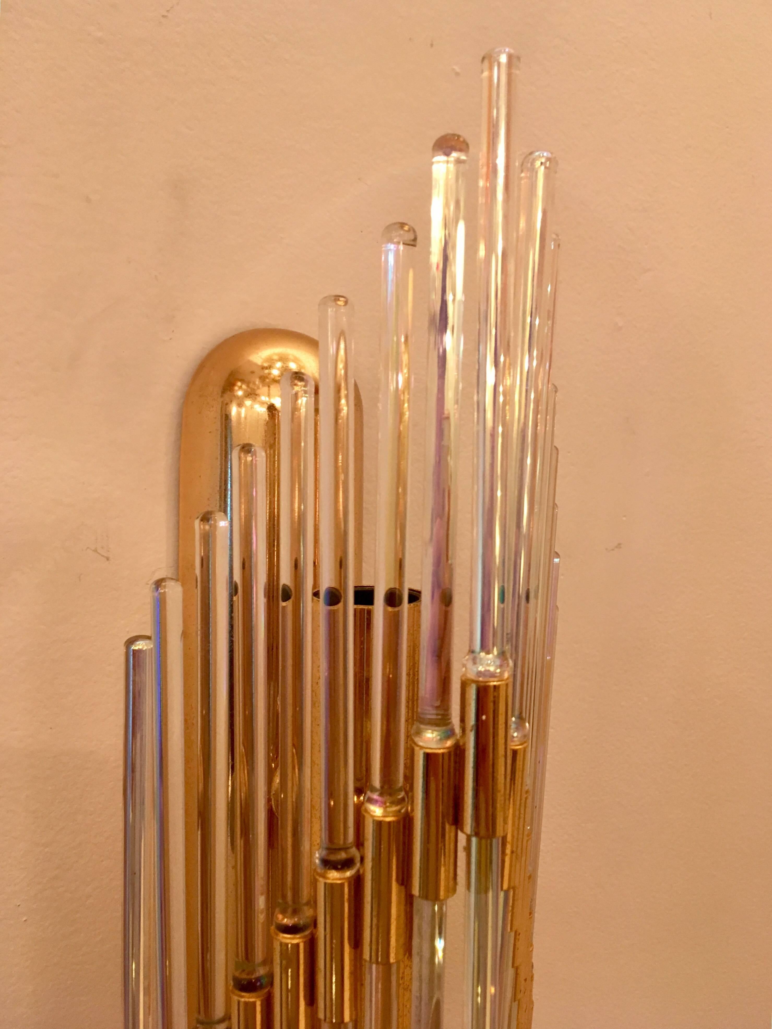A glamorous high style 1970s pair of wall lights with golden brass fixtures and iridescent glass rod elements which twinkle with rainbow coloring. Made by the famed Italian lighting company, Sciolari. Newly Rewired.
