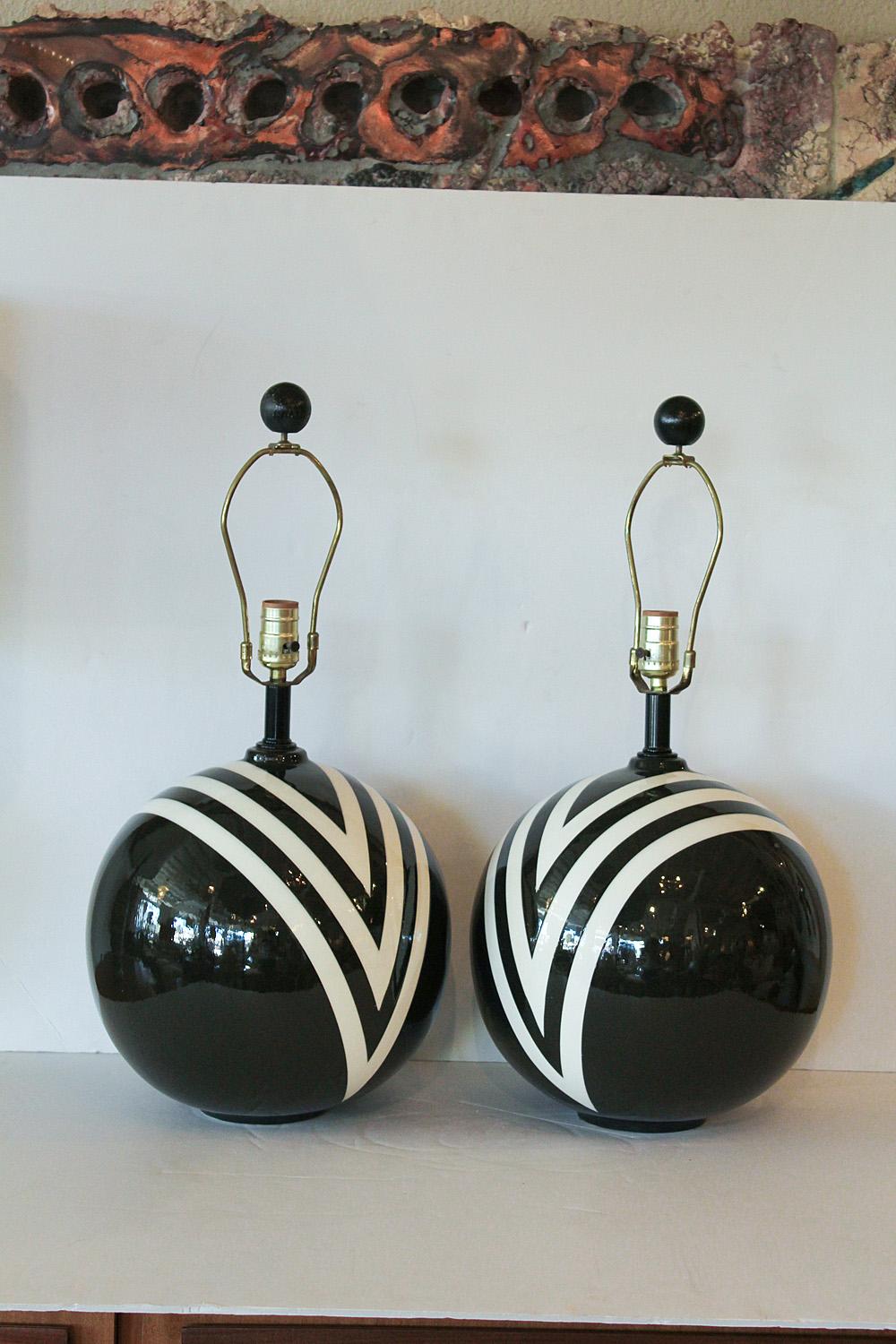 Great pair of large black and white striped ceramic lamps from the 1980's
Stripes are on the back and the front in the same pattern.

We love them !