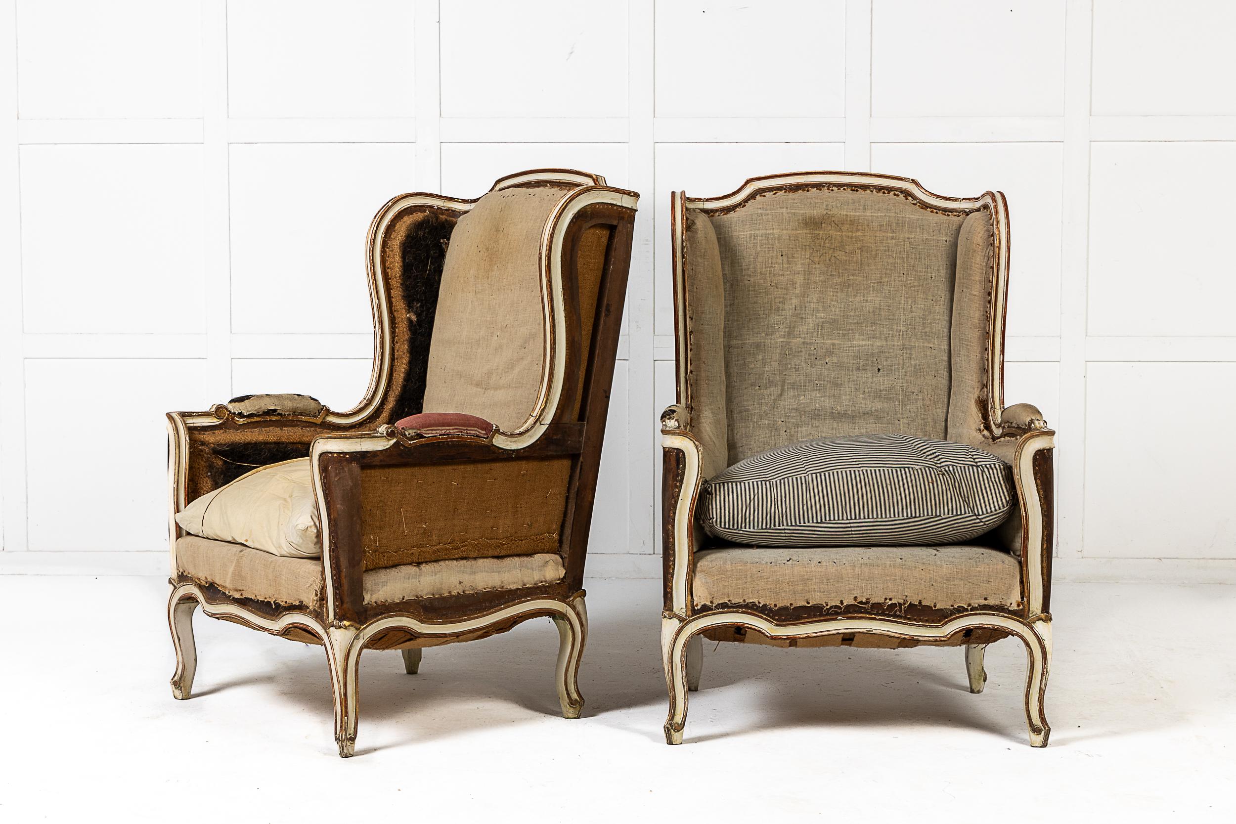 A Good Pair of French 19th Century Bergère or Wing Armchairs.

The part painted surfaces with parcel gilt highlights and the front rails of gentle serpentine form. Ready for the client to upholster in a fabric of their choice.
