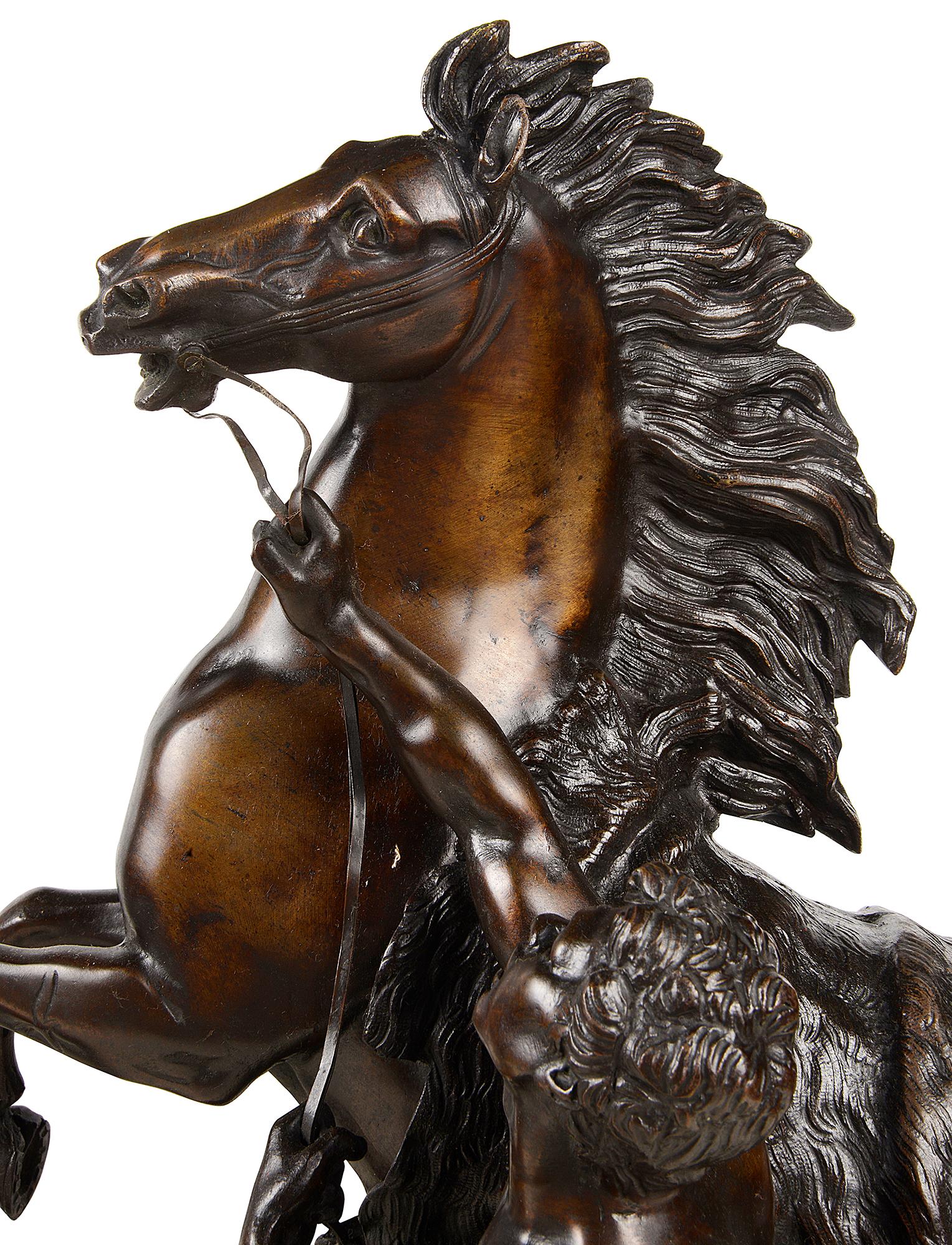 A very impressive pair of 19th century bronze Marly horse, having a good patina, after Guillaume Coustou the elder 1677-1746.

