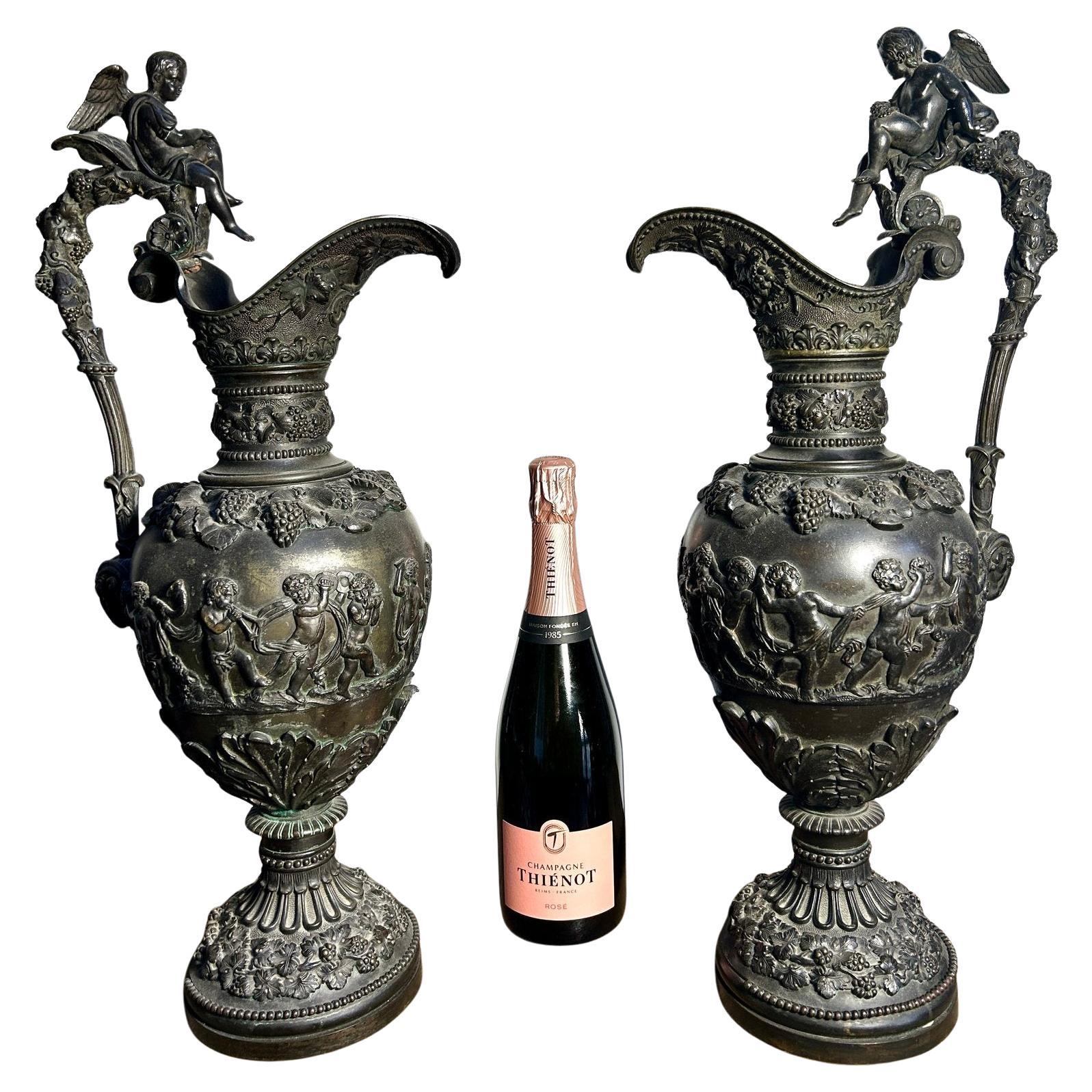 Large Pair of 19th Century French Bacchanalian Bronze Ewers with Cupid Figures