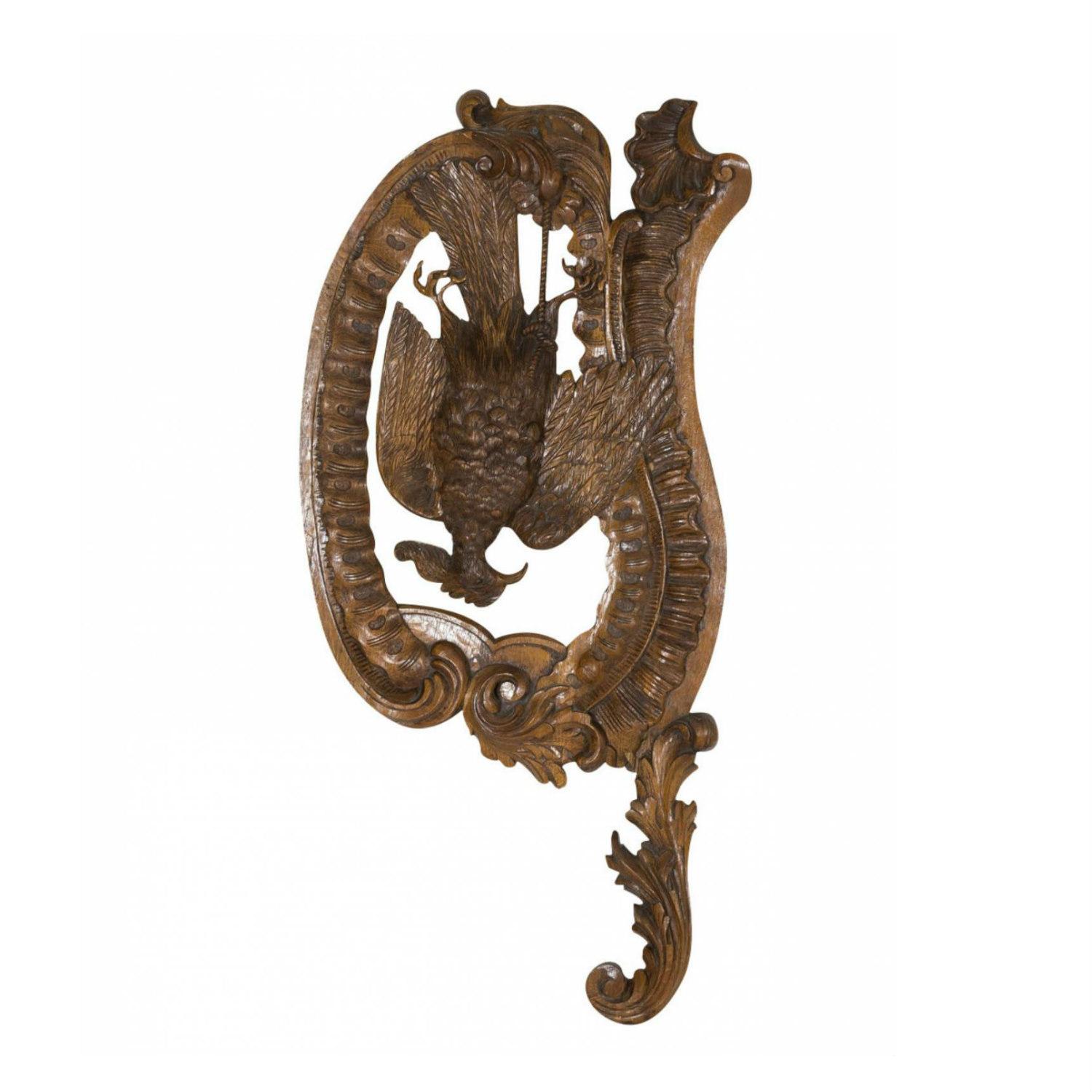 A fine pair of 19th century French oak hunting trophy plaques depicting intricately carved hanging dead game birds, a pheasant on the left and a bécasse or woodcock on the right, circa 1880s. These large fruits of the hunt plaques are each carved