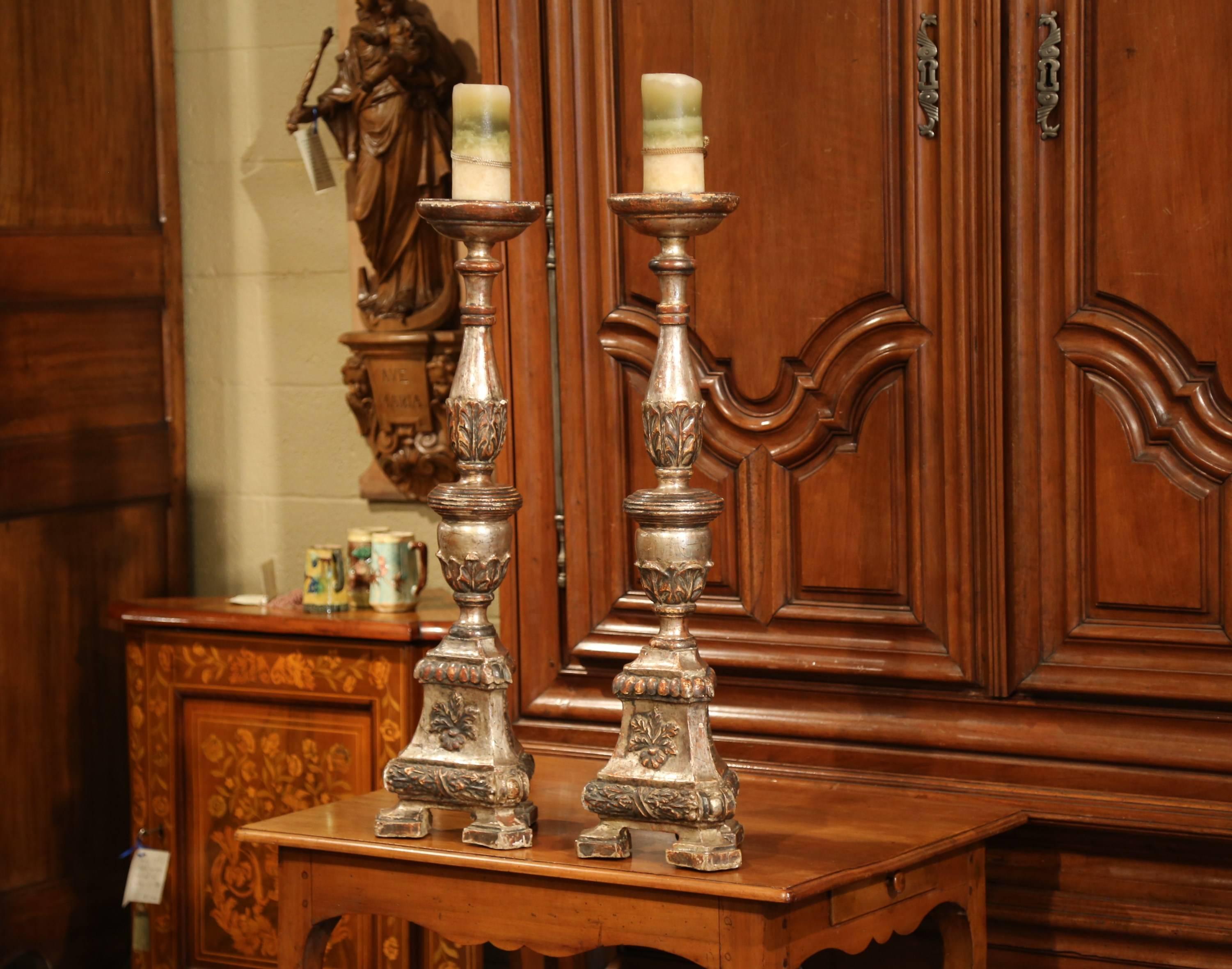 These tall Pic-Cierges were created in Italy, circa 1880. Standing on three small, square feet over a triangle base decorated with flower medallions on all three sides, each candlestick has a carved stem embellished with acanthus leaves and an iron