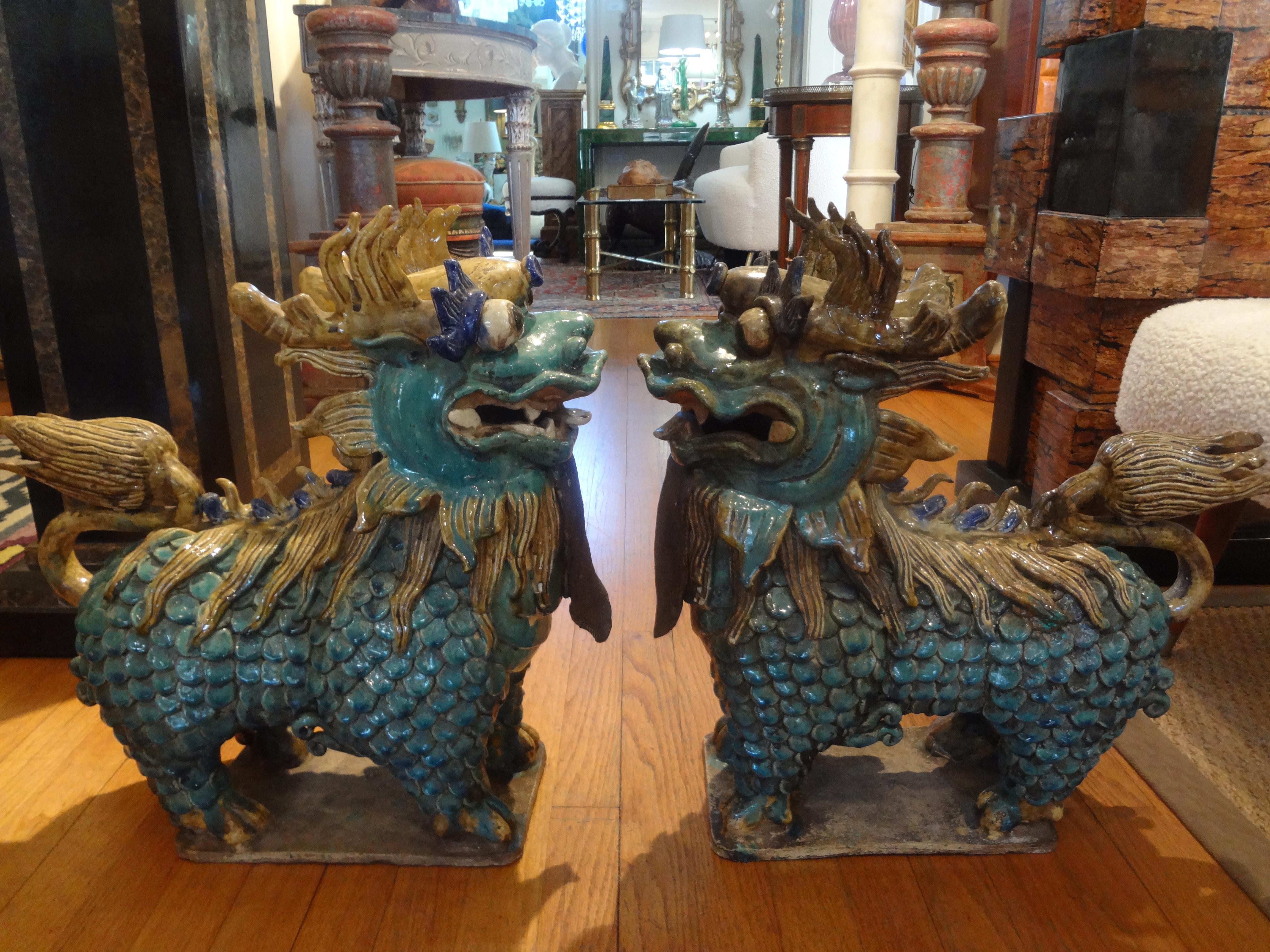 Large pair of antique Chinese porcelain foo dogs.
Stunning pair of antique Chinese hand decorated porcelain foo dogs or foo lions. This beautiful pair of Chinese foo dogs are executed in fabulous and unusual colors and date to the 1920s-1930s.