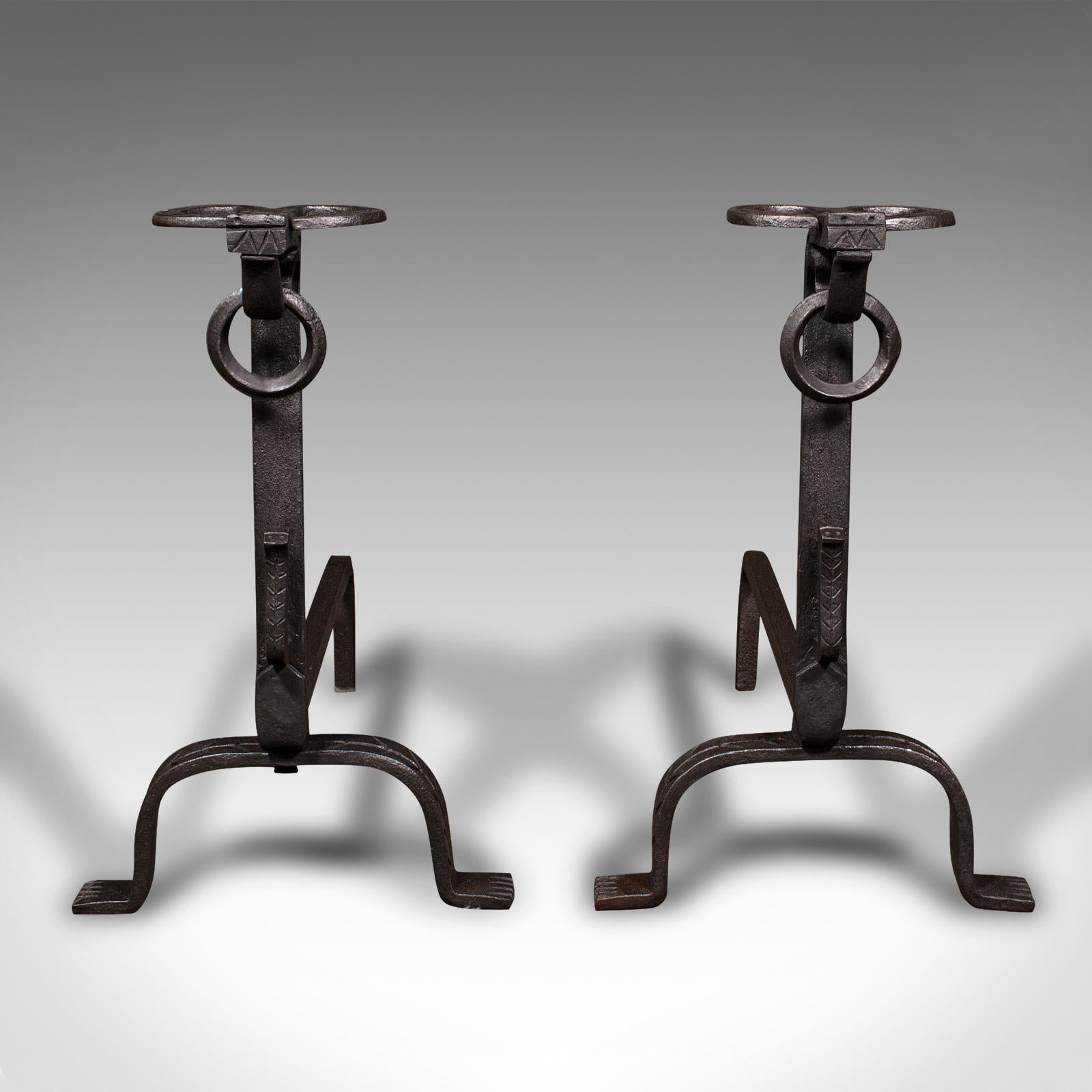 This is a large pair of antique firedogs. An English, wrought iron fireplace andirons, dating to the Victorian period, circa 1900.

Substantial size, ideal as tool rests or hosting a large fire grate
Displaying a desirable aged patina and in good